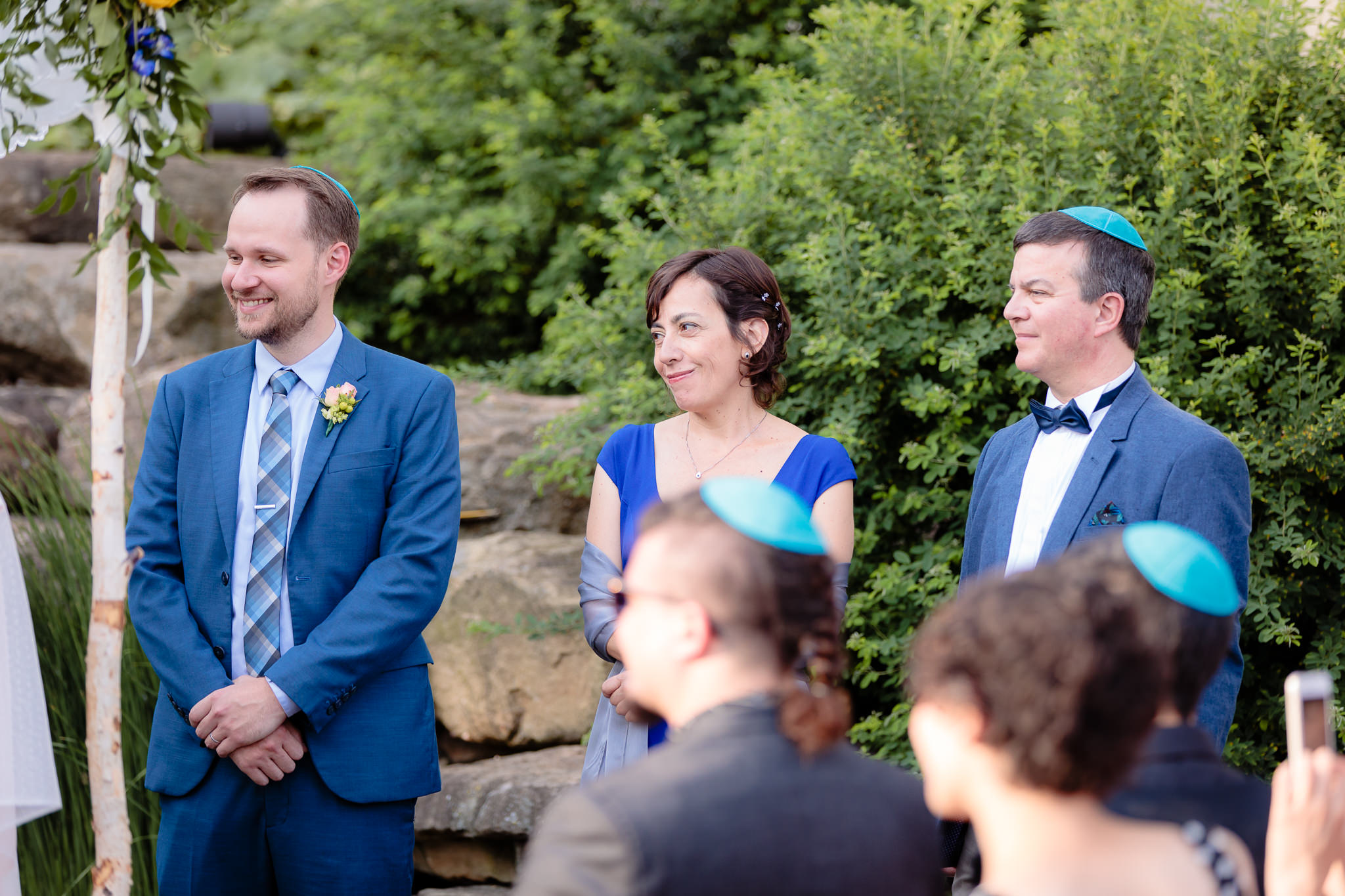 Parents of the groom & best man smile as he gets married at Phipps Conservatory