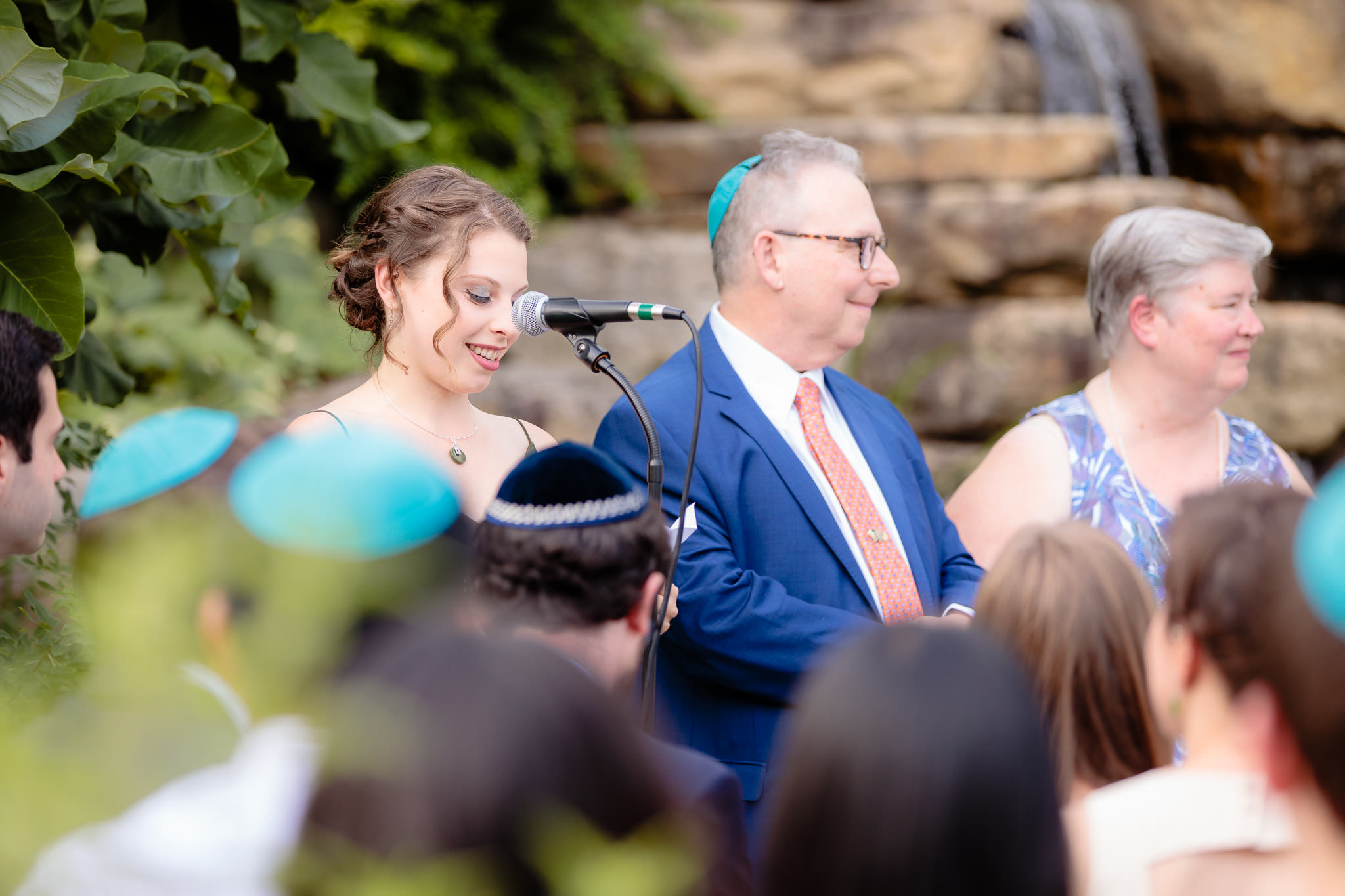 Sister of the bride speaks during a Jewish wedding ceremony at Phipps