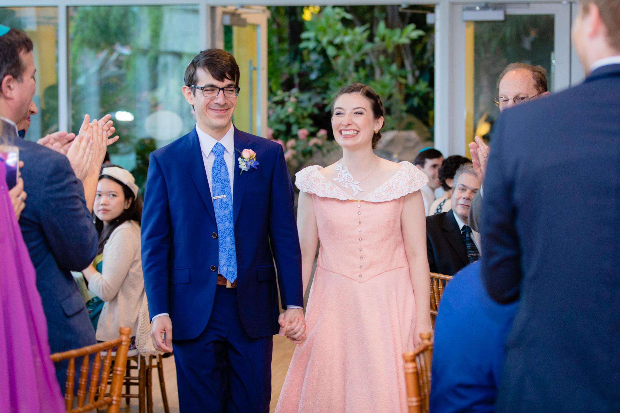Newlyweds enter their reception at Phipps Conservatory