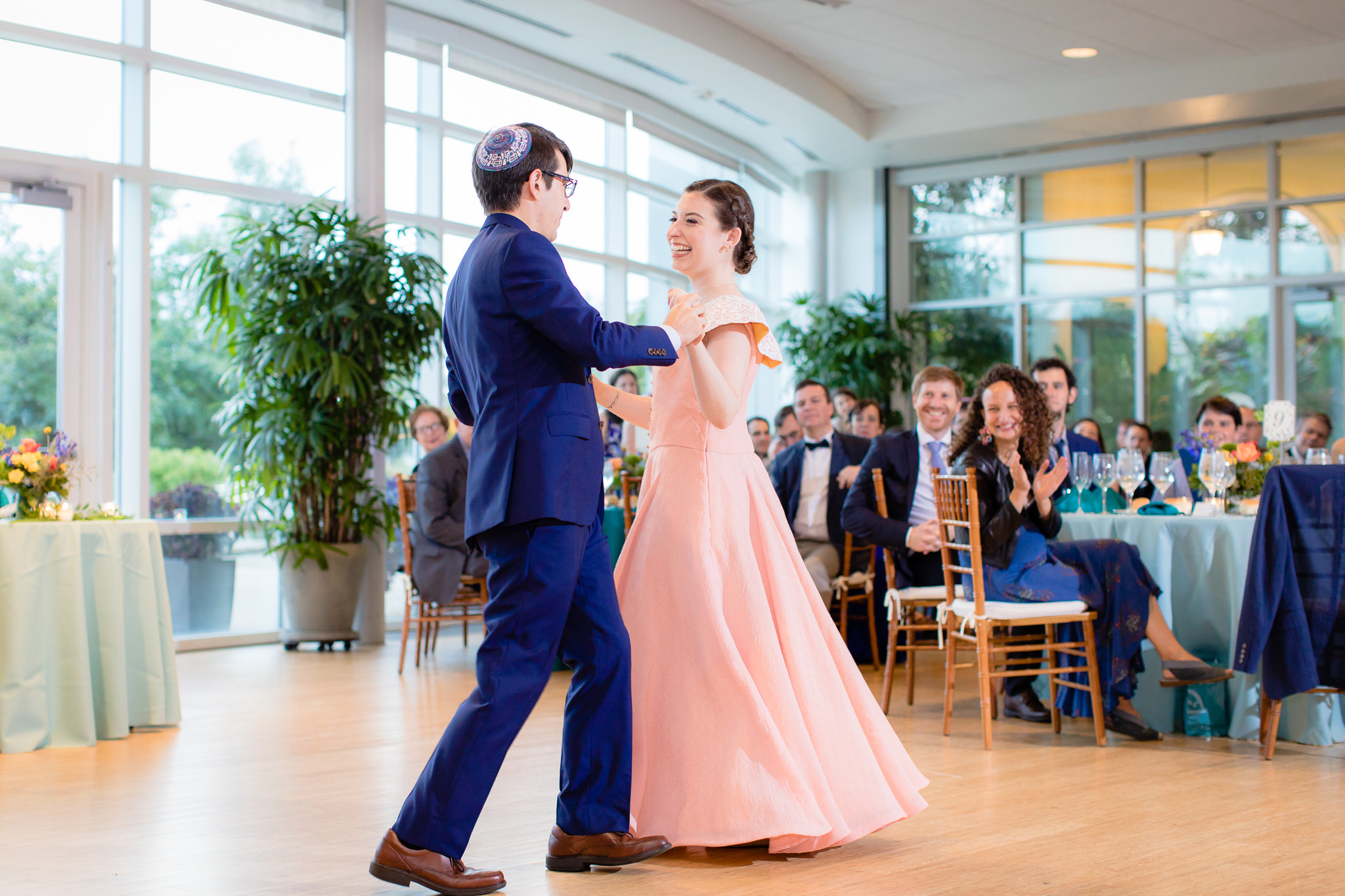Bride & groom share a choreographed first dance at Phipps Conservatory