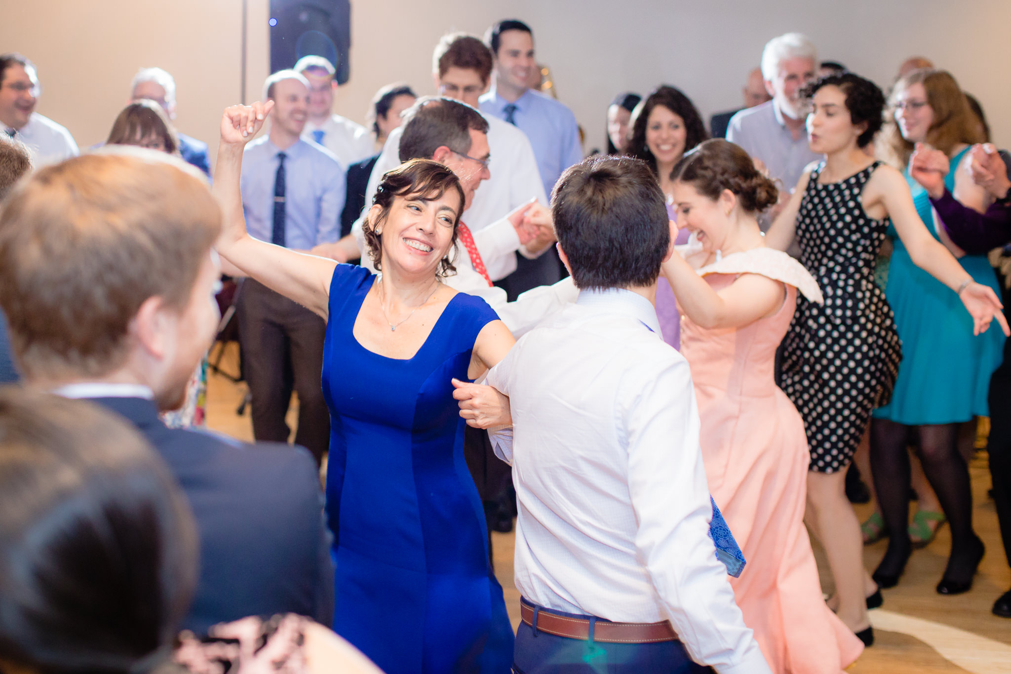 Groom dances with his mother during the hora at a Jewish wedding reception at Phipps Conservatory