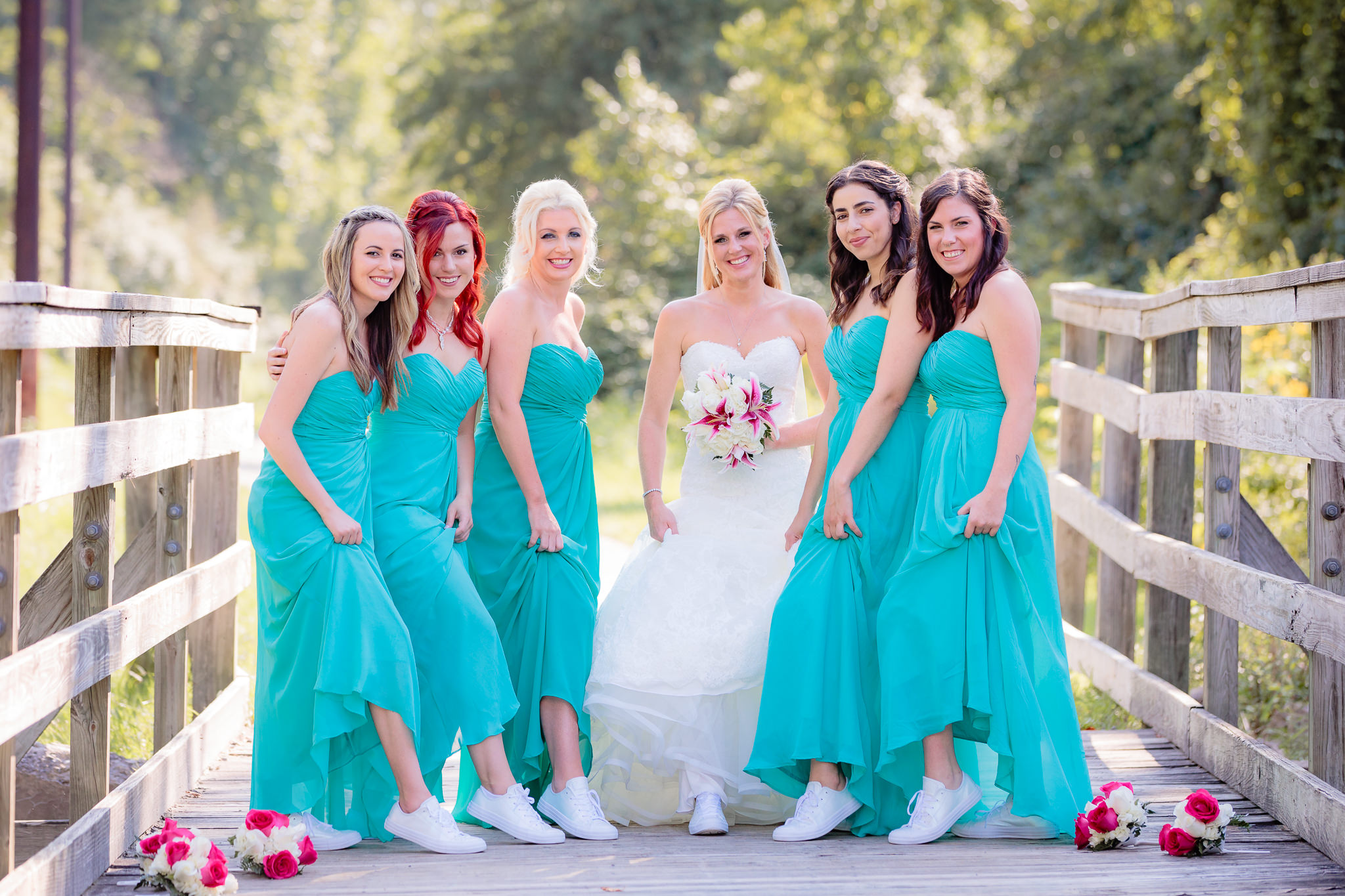 Bridesmaids show off their white Converse All Stars before a Pittsburgh Airport Marriott wedding