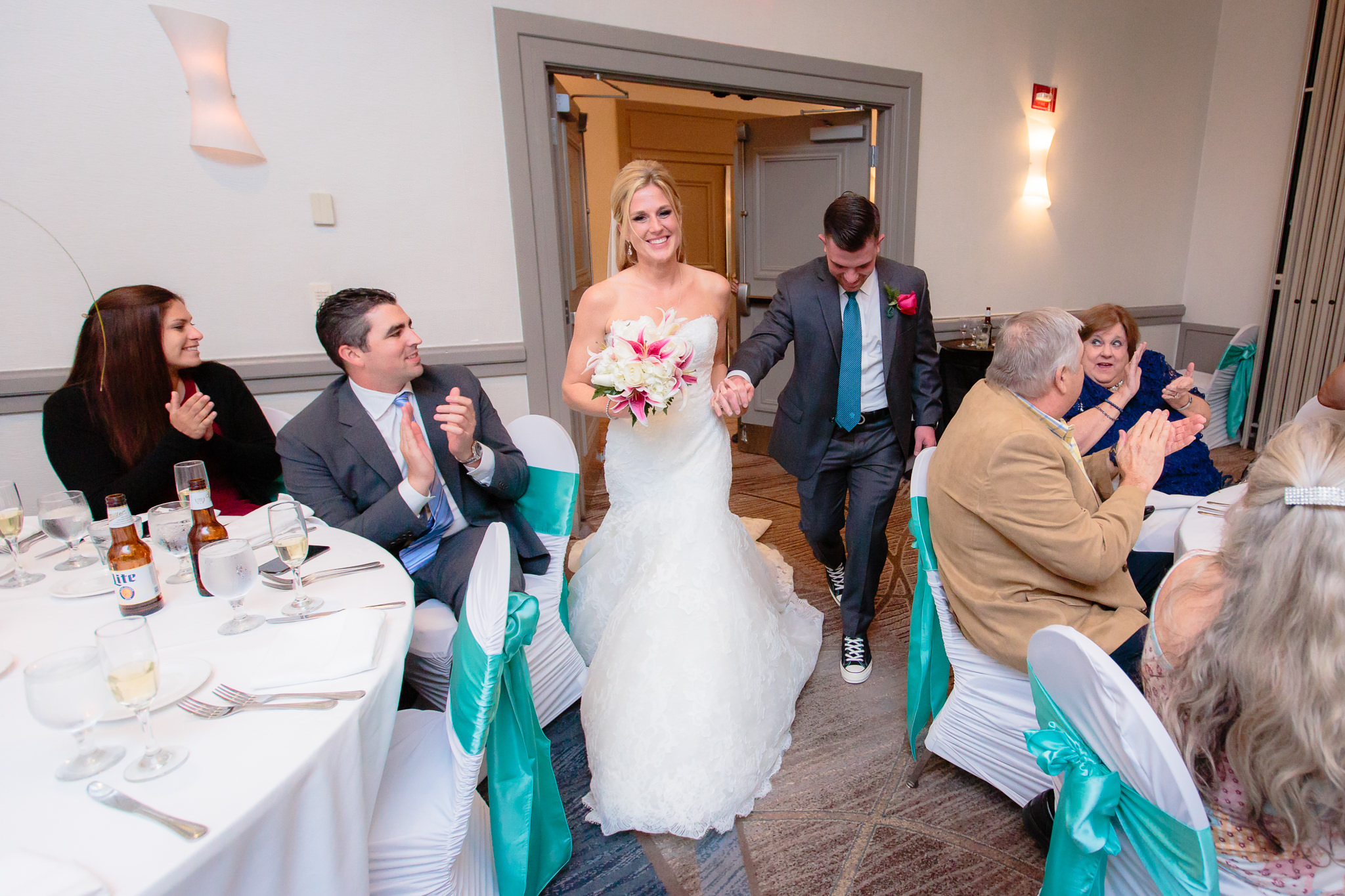Newlyweds enter the Three Rivers Ballroom at the Pittsburgh Airport Marriott