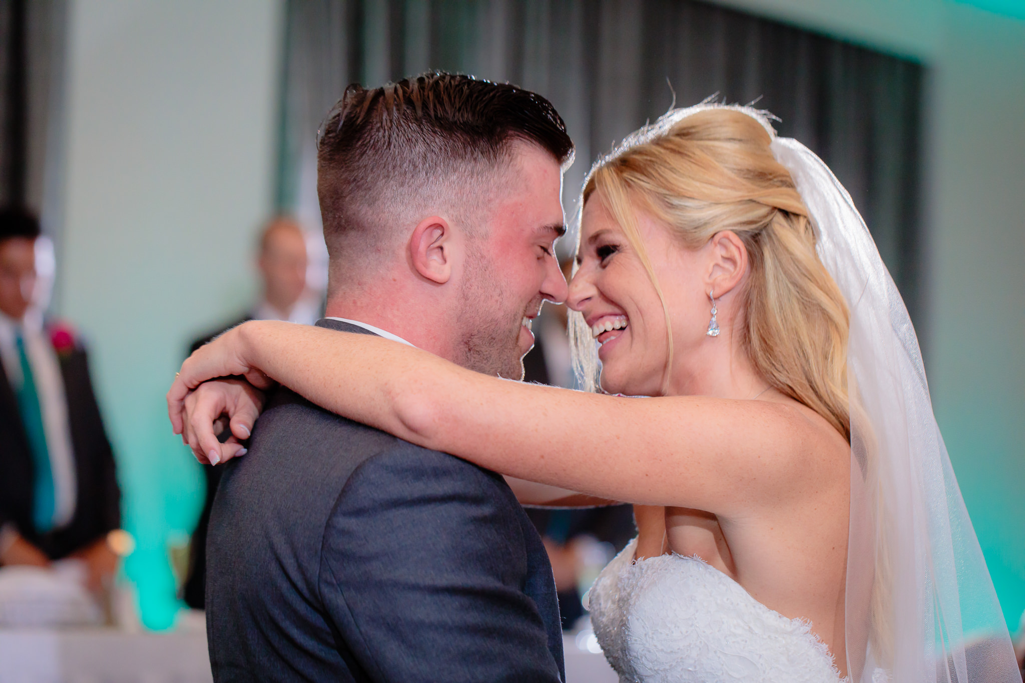 Bride and groom laugh during their first dance at the Pittsburgh Airport Marriott