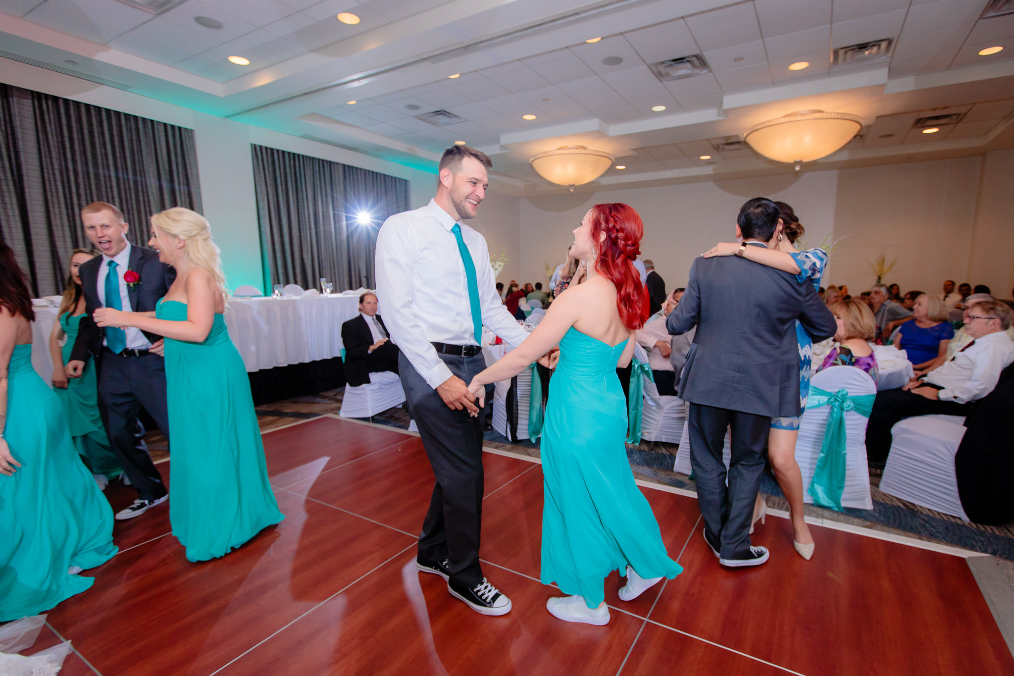 Best man dances with the maid of honor at a Pittsburgh Airport Marriott wedding