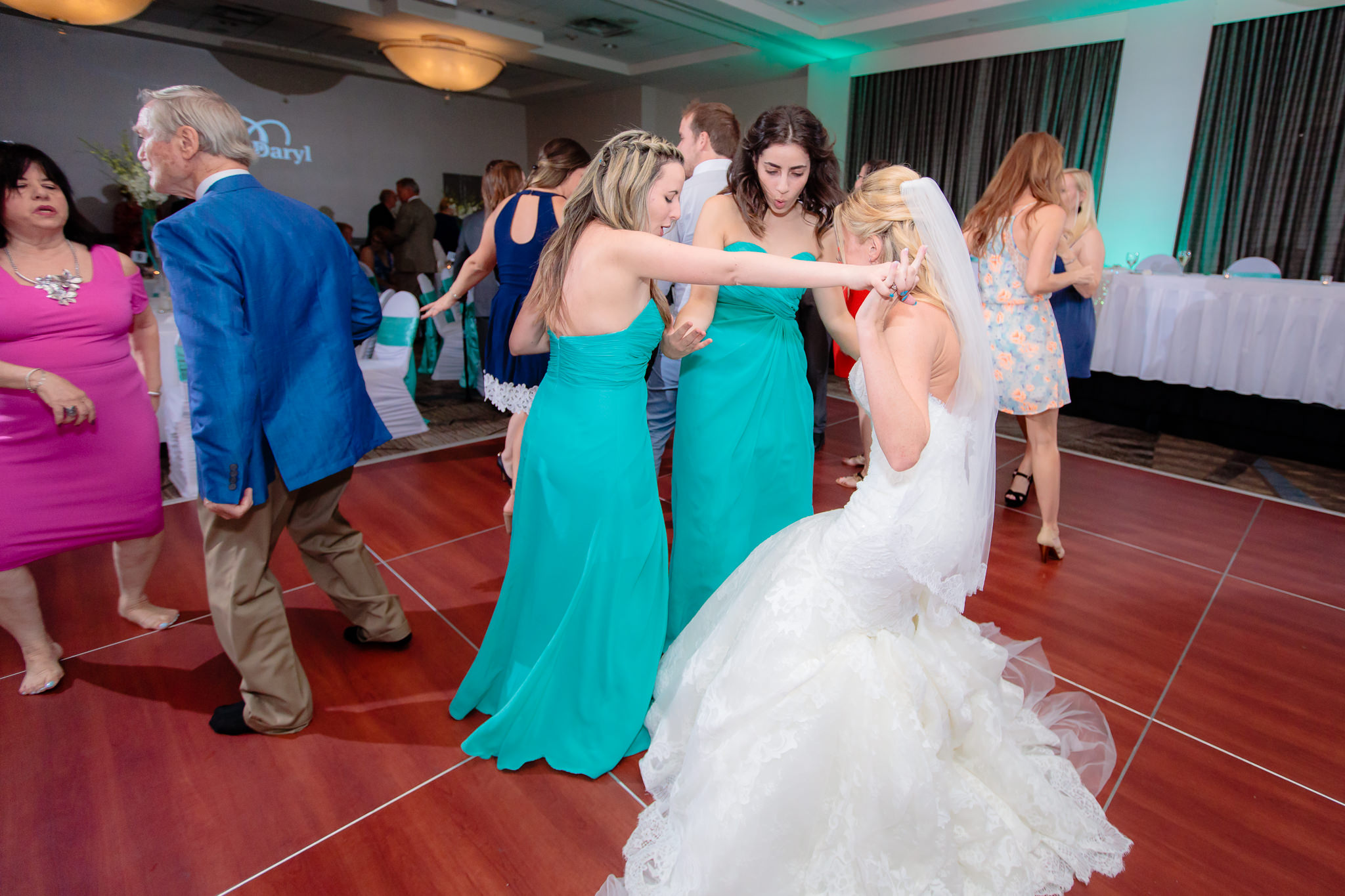 Bride dances with her bridesmaids at the Pittsburgh Airport Marriott