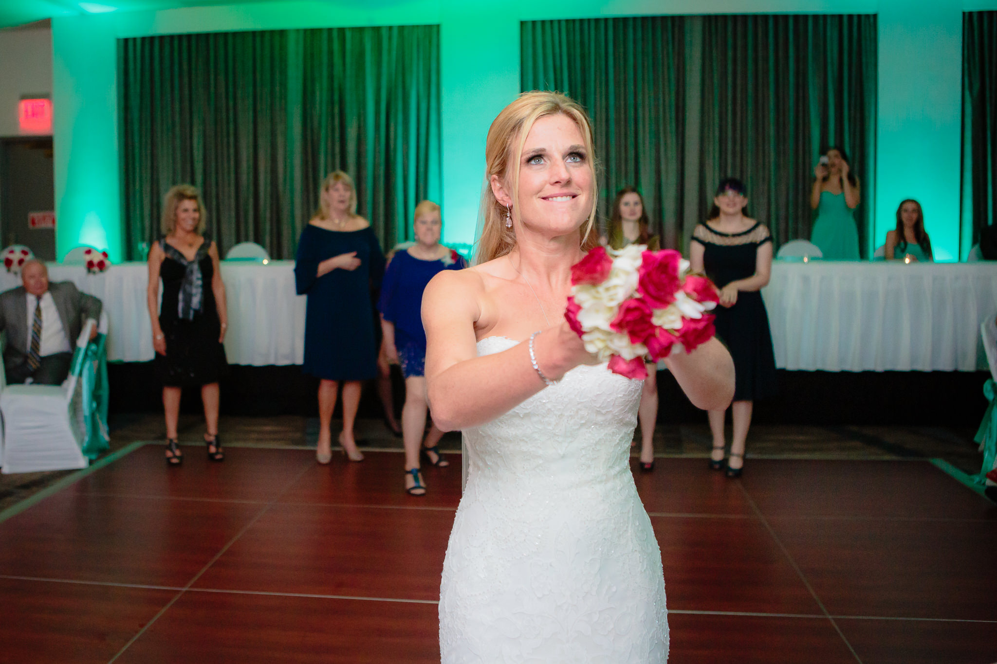 Bride gets ready to toss the bouquet at a Pittsburgh Airport Marriott wedding reception