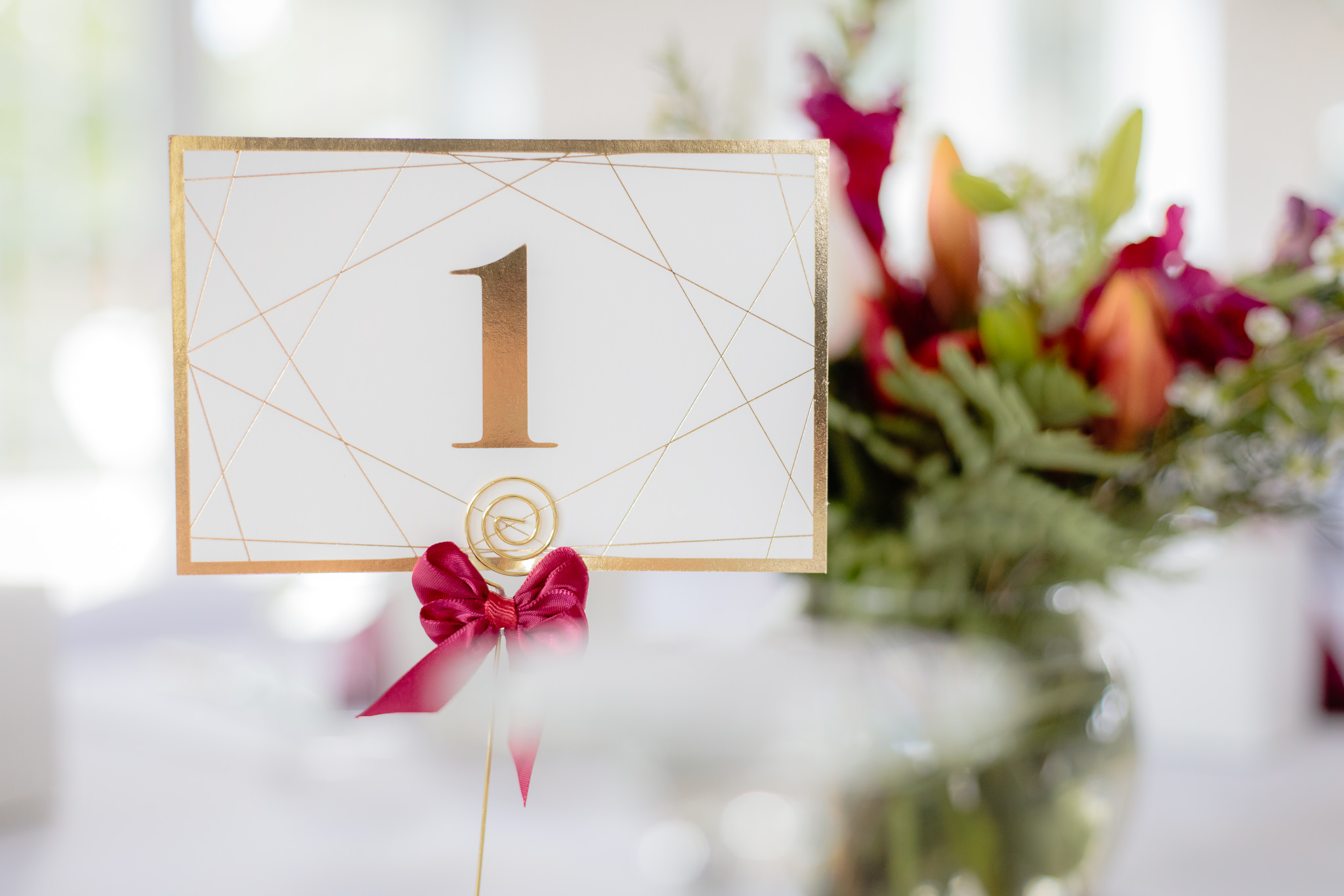 Gold foil-stamped table numbers at a Greystone Fields wedding