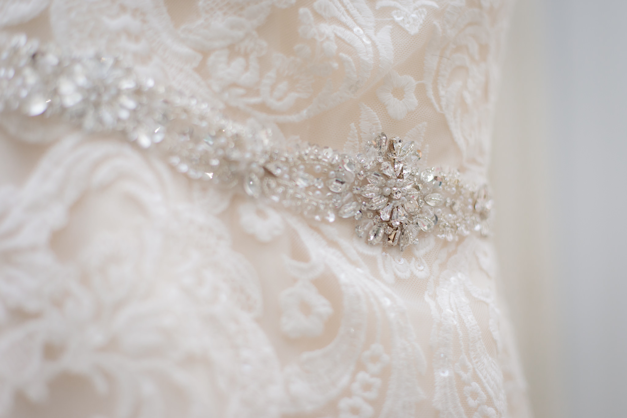 Beaded belt on bride's Allure wedding dress at Greystone Fields