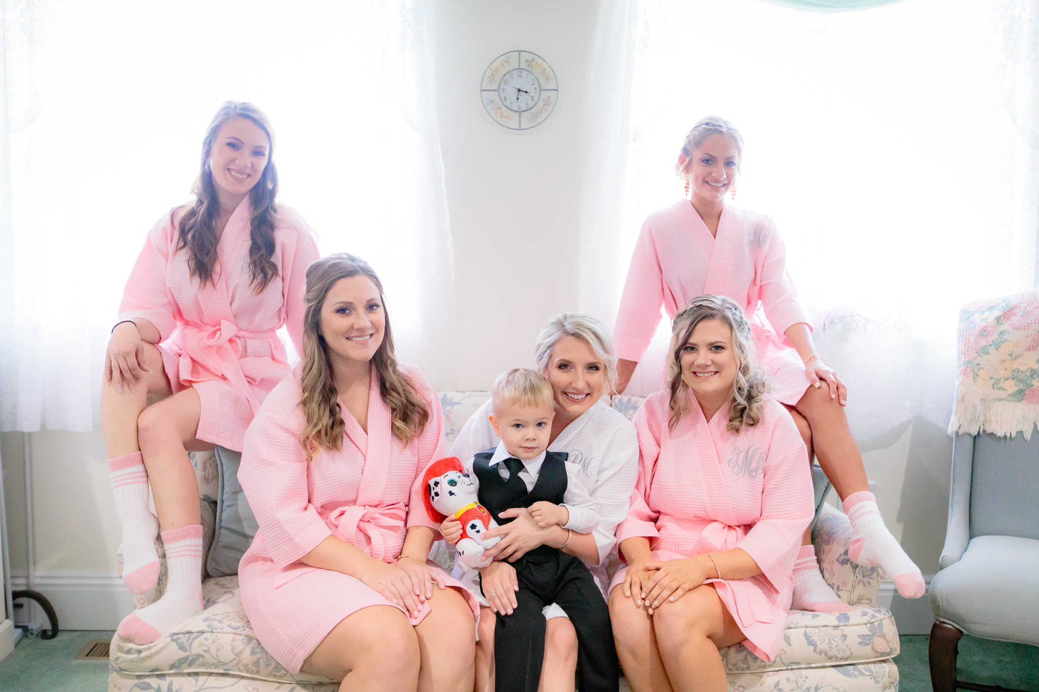 Bridesmaids and ring bearer on the couch at Greystone Fields
