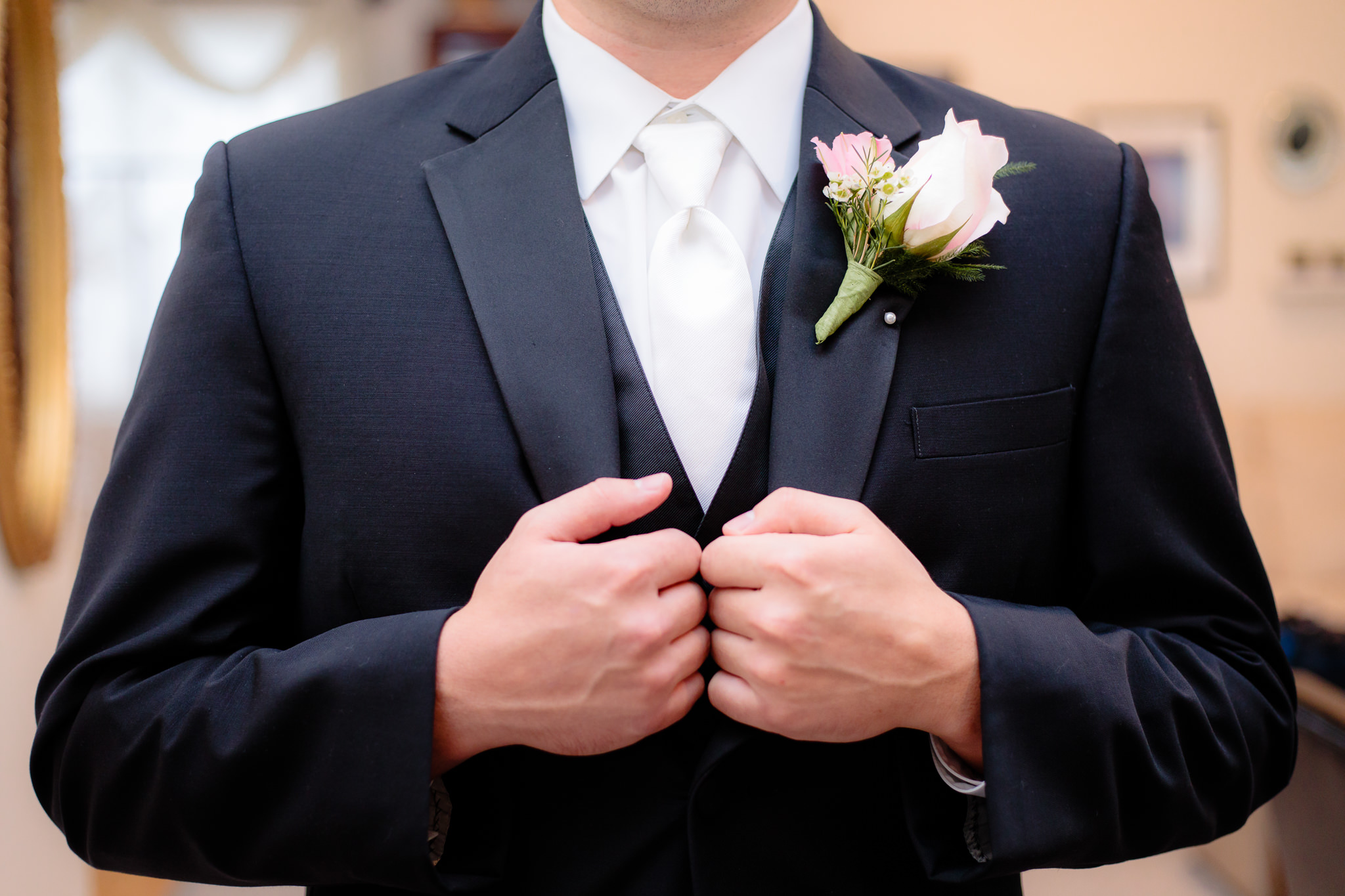 Groom's boutonniere on a black jacket at Greystone Fields