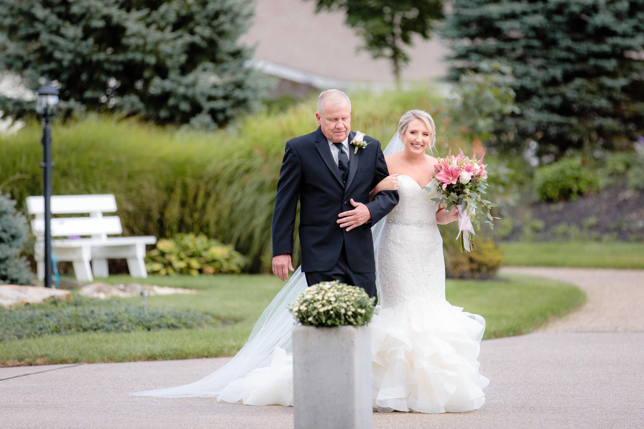 Father of the bride walks her to her outdoor ceremony at Greystone Fields