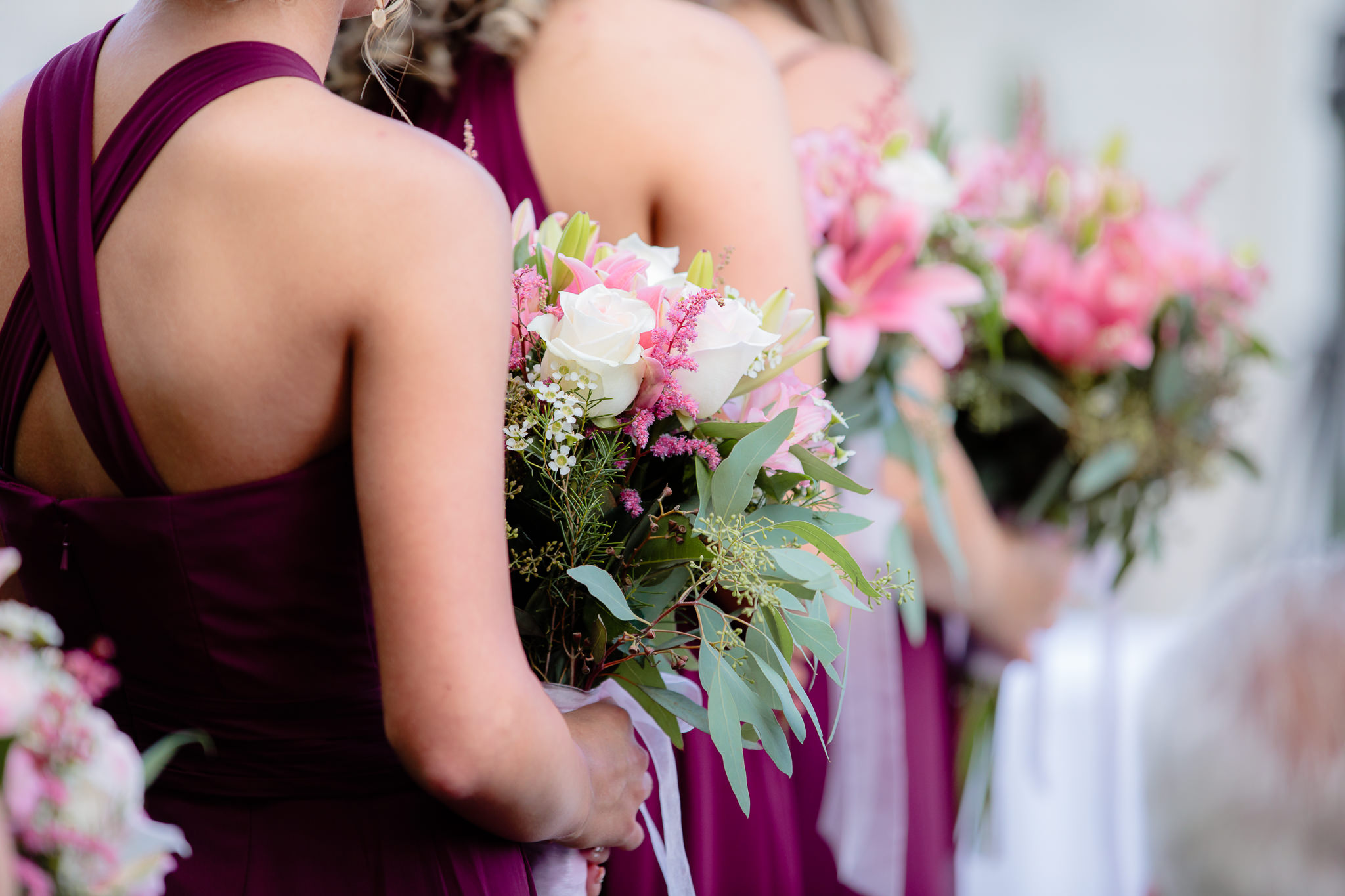 Bridesmaids hold bouquets by Weischedel Florist at Greystone Fields