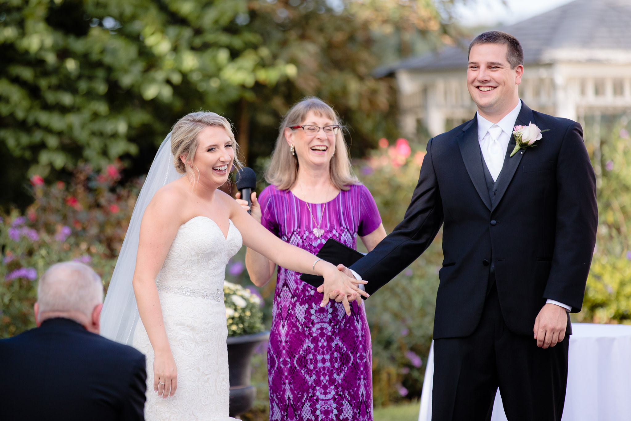 Bride & groom smile at their guests during a Greystone Fields wedding