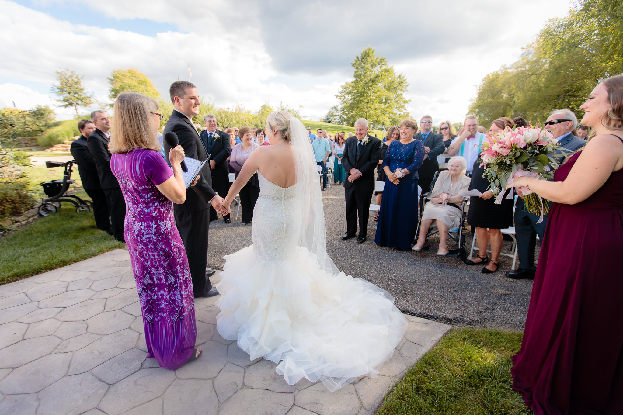 Guests stand to honor the bride & groom at a Greystone Fields wedding