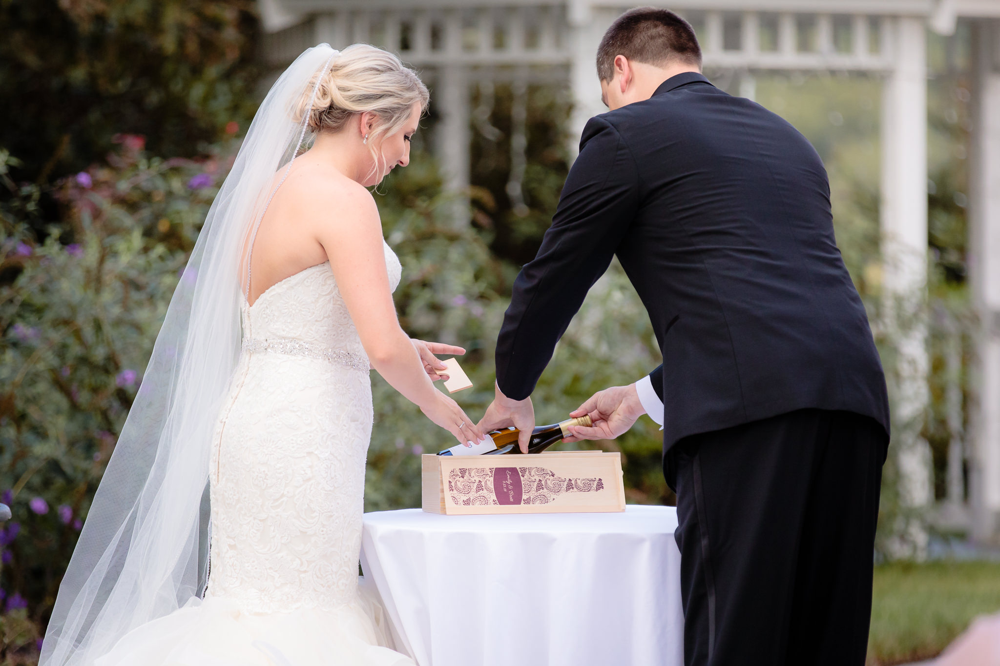 Bride & groom put wine & notes in a box at a Greystone Fields wedding