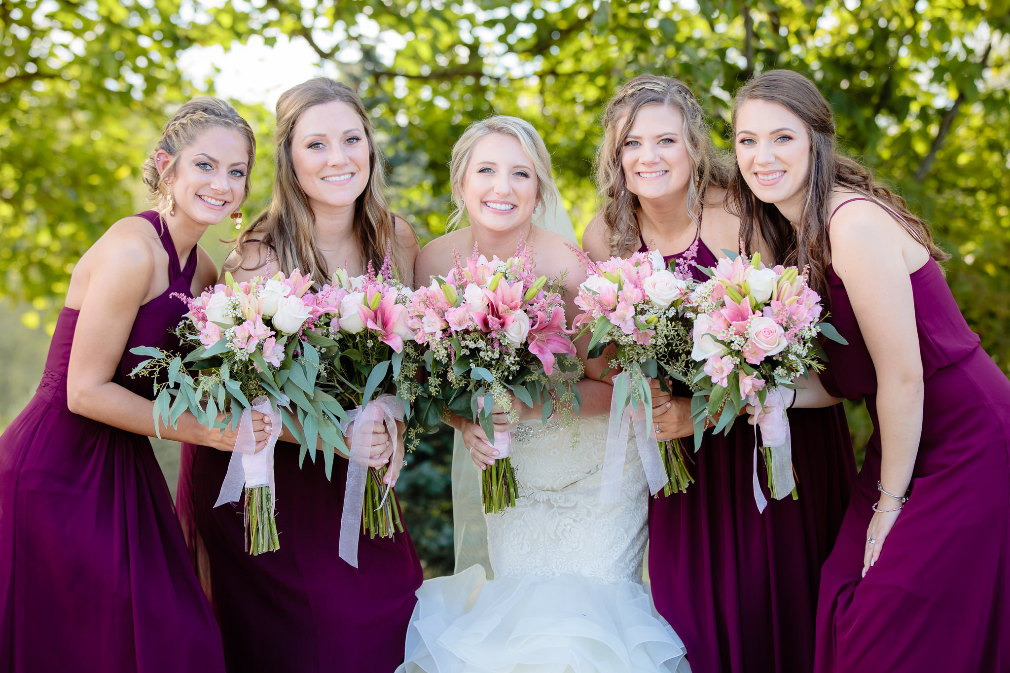 Bride smiles with her bridesmaids at Greystone Fields