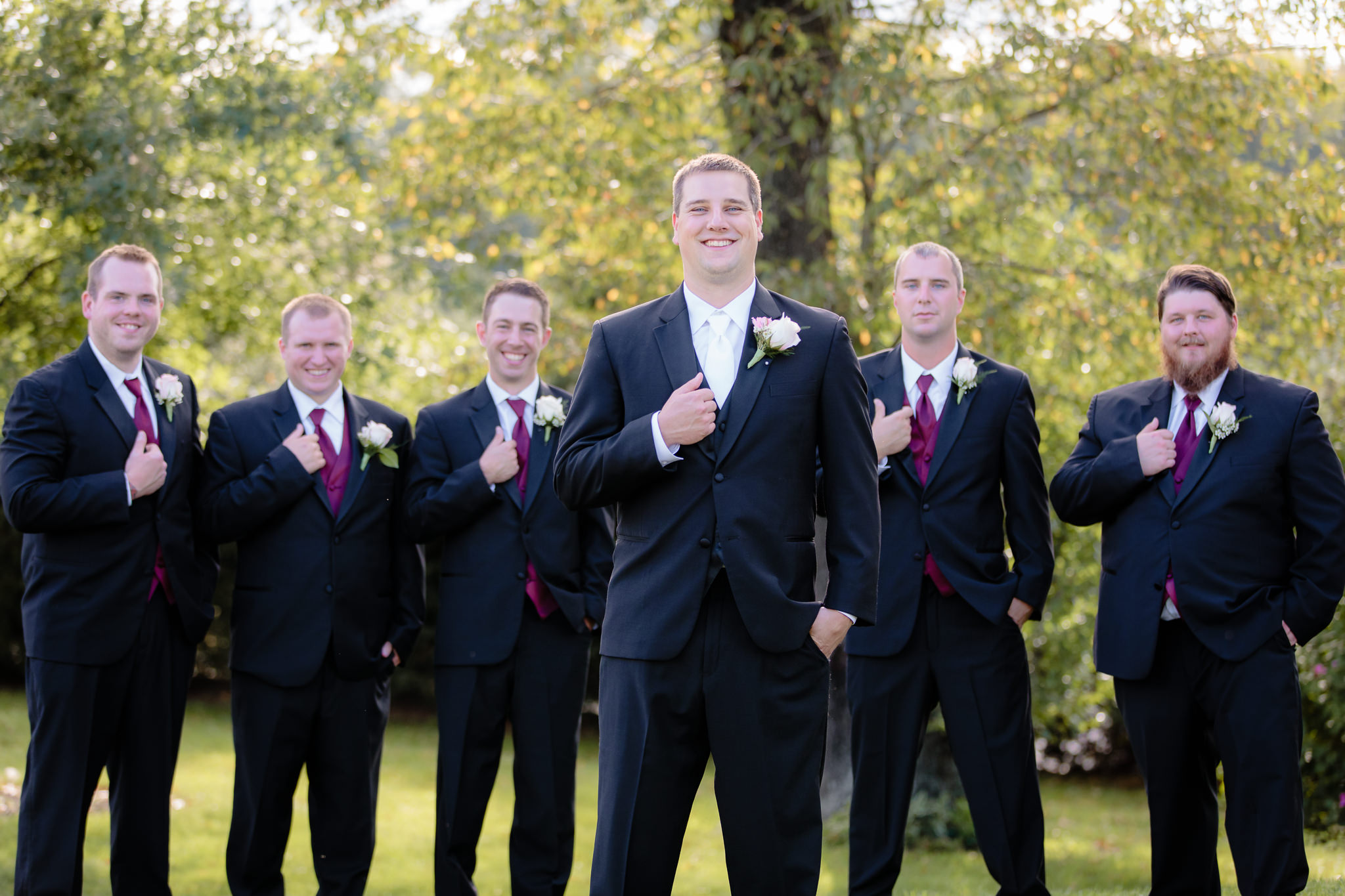 Groom poses with his groomsmen at Greystone Fields
