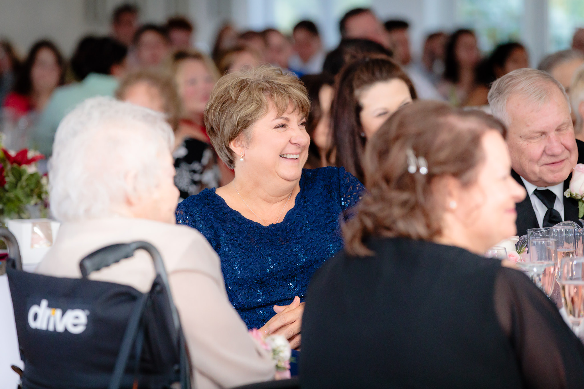 Mother of the bride laughs during speeches at Greystone Fields
