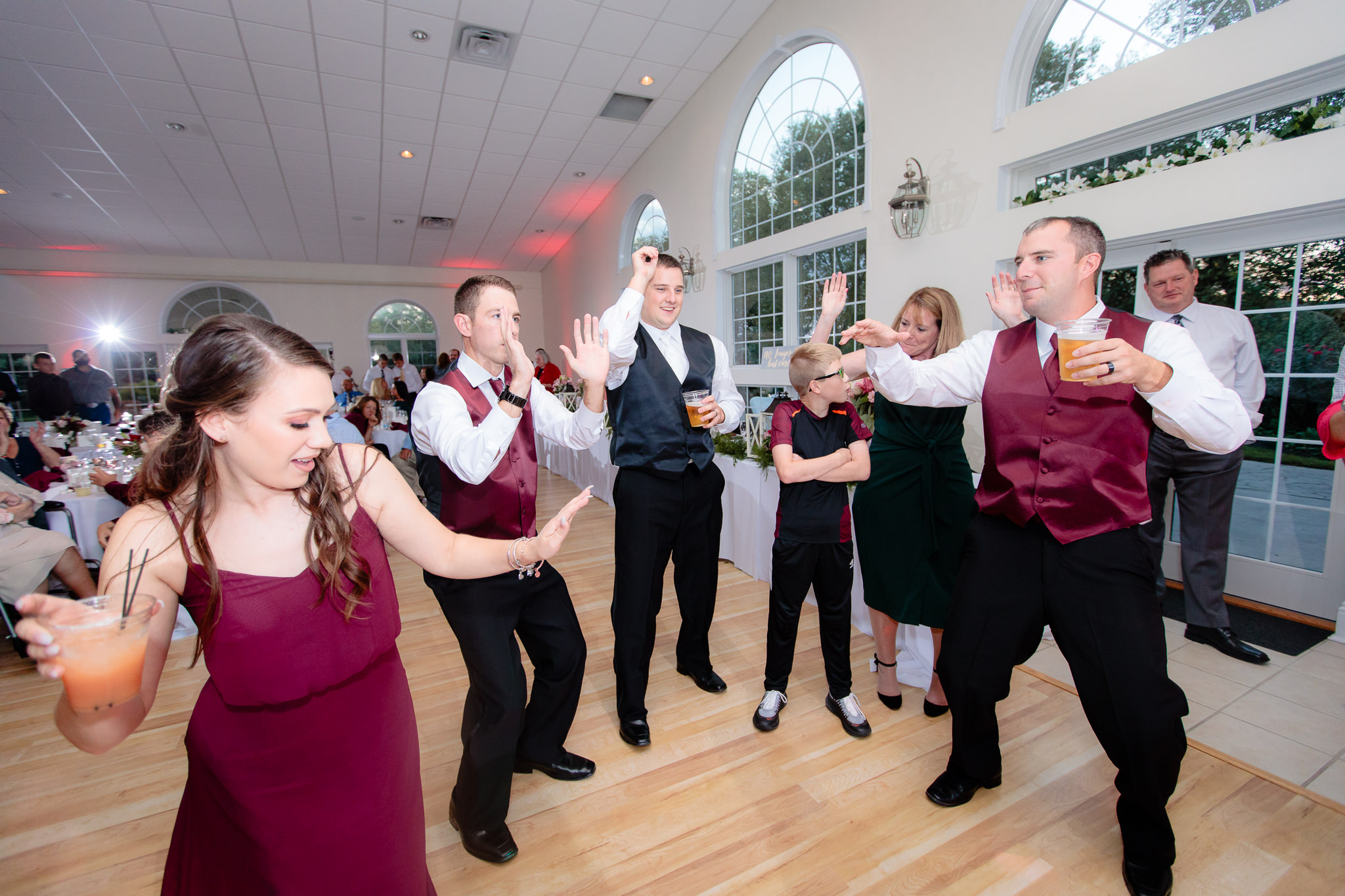 Groom and groomsmen dance at a Greystone Fields wedding