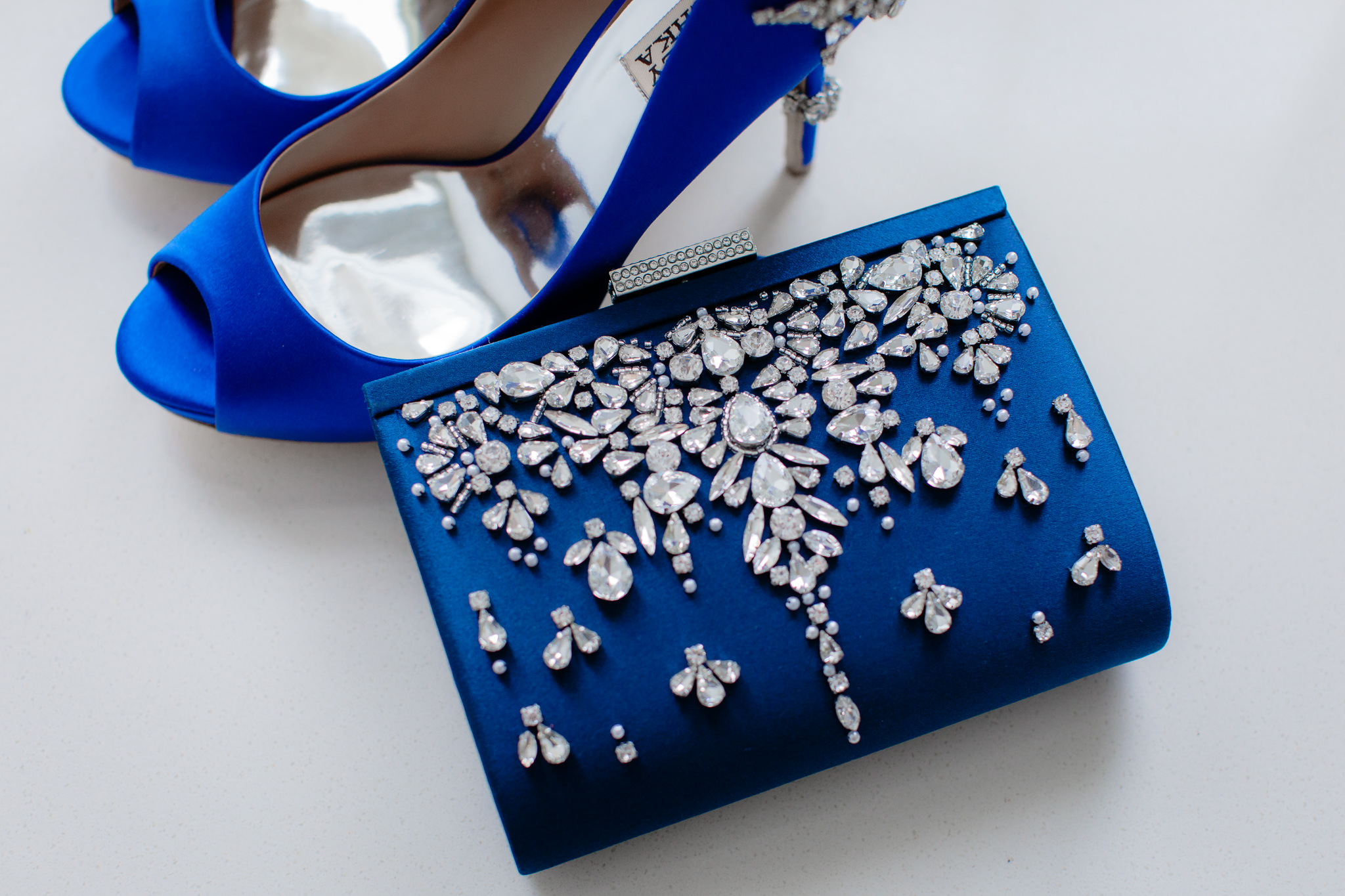 Bride's navy blue clutch purse adorned with rhinestone accents