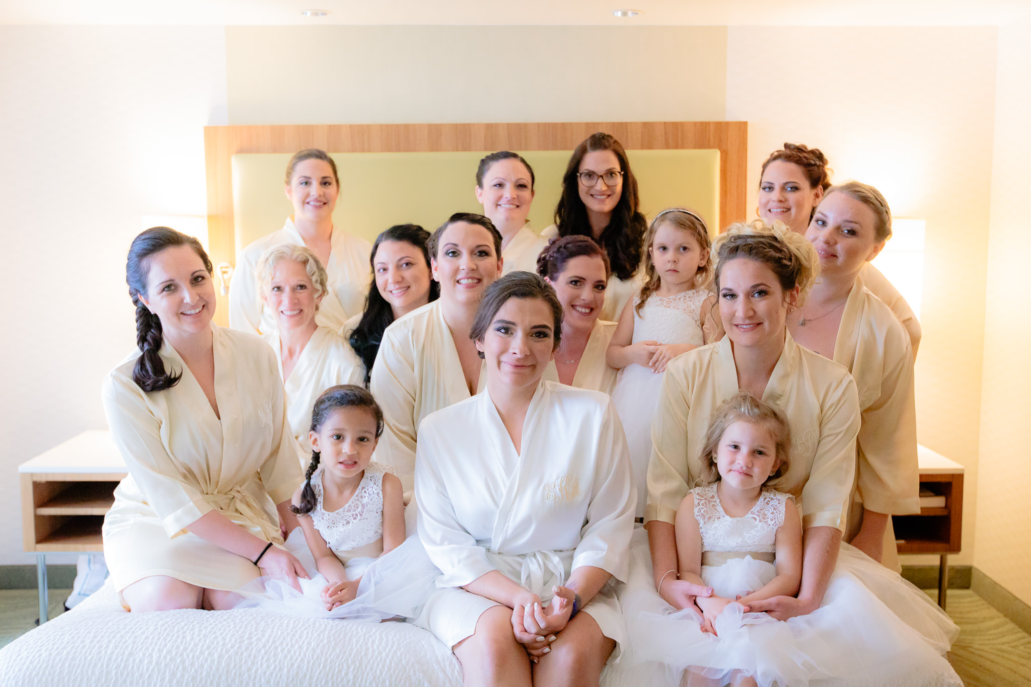 Bridesmaids gather in their custom monogrammed robes before a National Aviary wedding