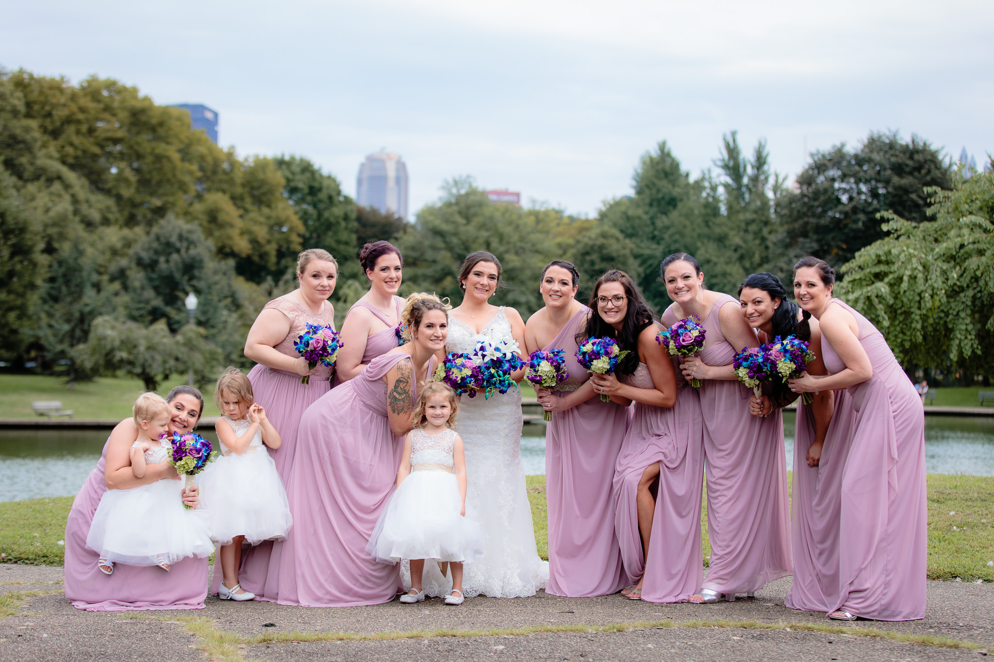 Bridesmaids wear purple dresses for a National Aviary wedding