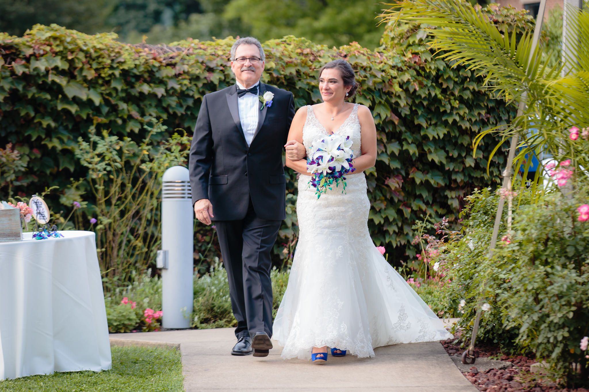 Father of the bride escorts his daughter to her National Aviary wedding ceremony