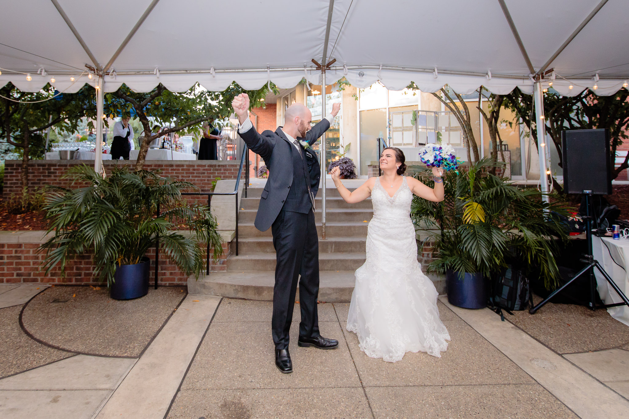 Bride & groom are announced into their reception at the National Aviary
