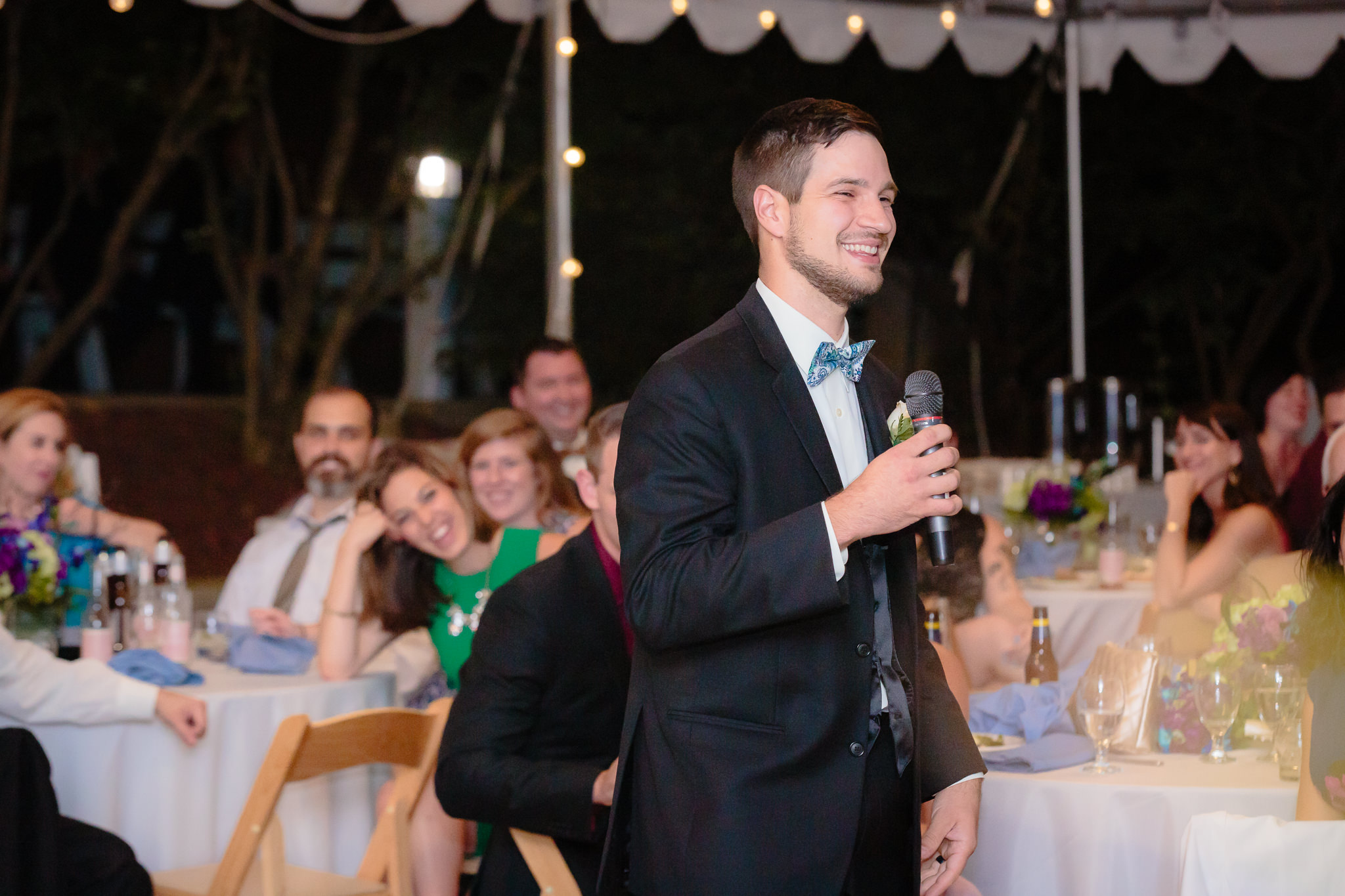 Best man gives a speech at a National Aviary wedding reception