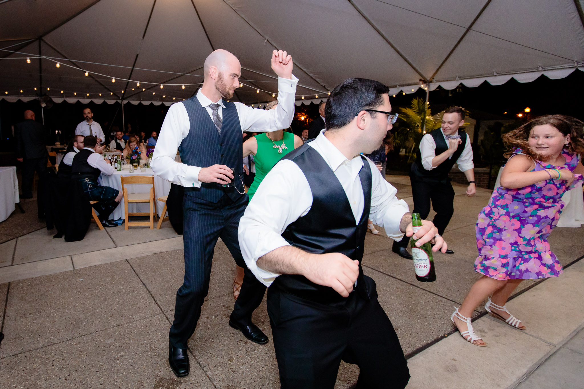 Groom learns a line dance at his National Aviary wedding reception