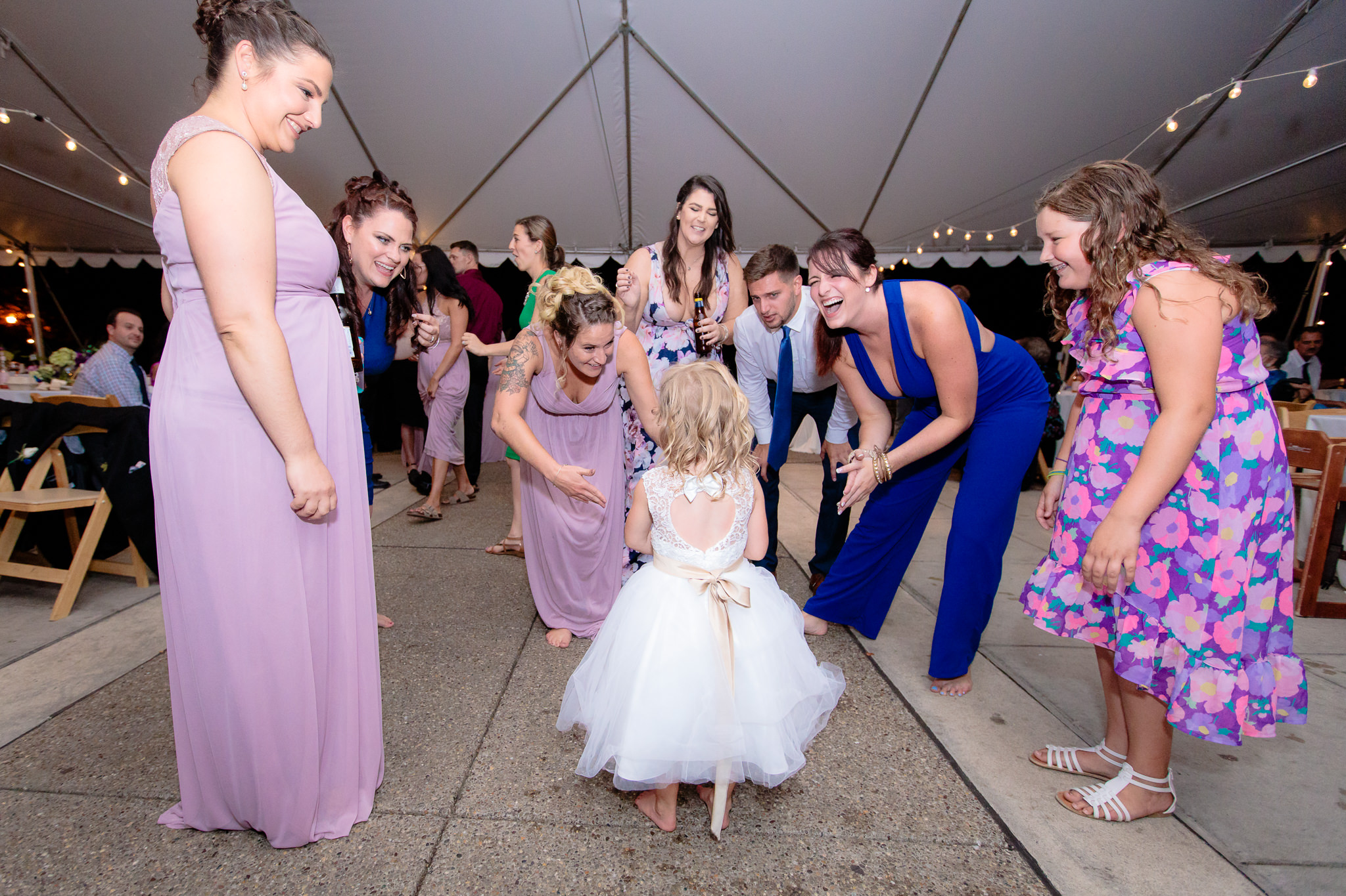 Guests dance with the flower girl at a National Aviary wedding