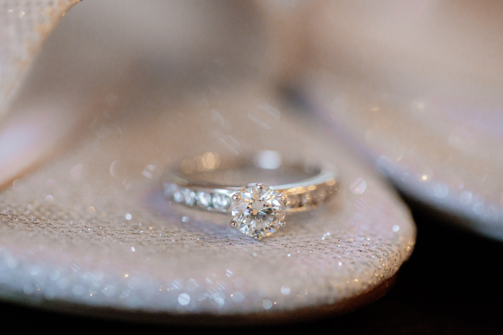 Tiffany engagement ring rests in the opening of bride's silver shoes at Oglebay