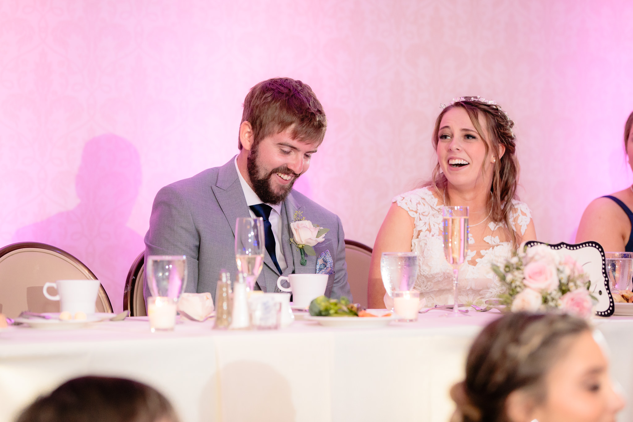 Bride & groom laugh during speeches at their Oglebay wedding