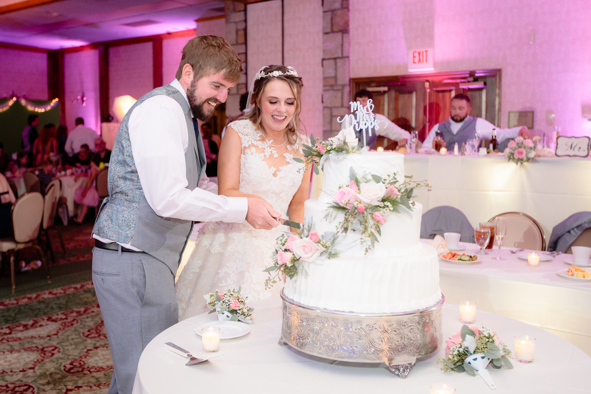 Newlyweds cut the cake at their Oglebay wedding reception