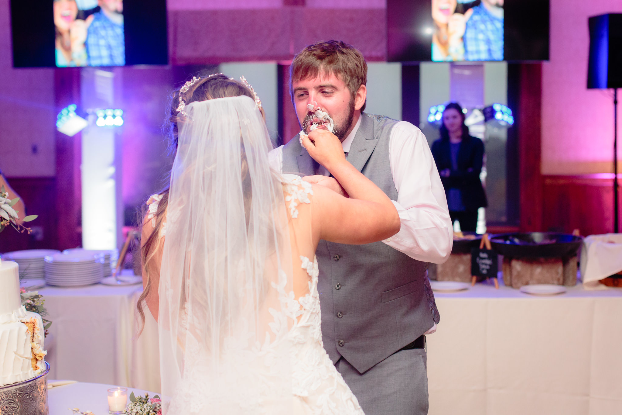 Bride smashes cake into groom's face at an Oglebay wedding