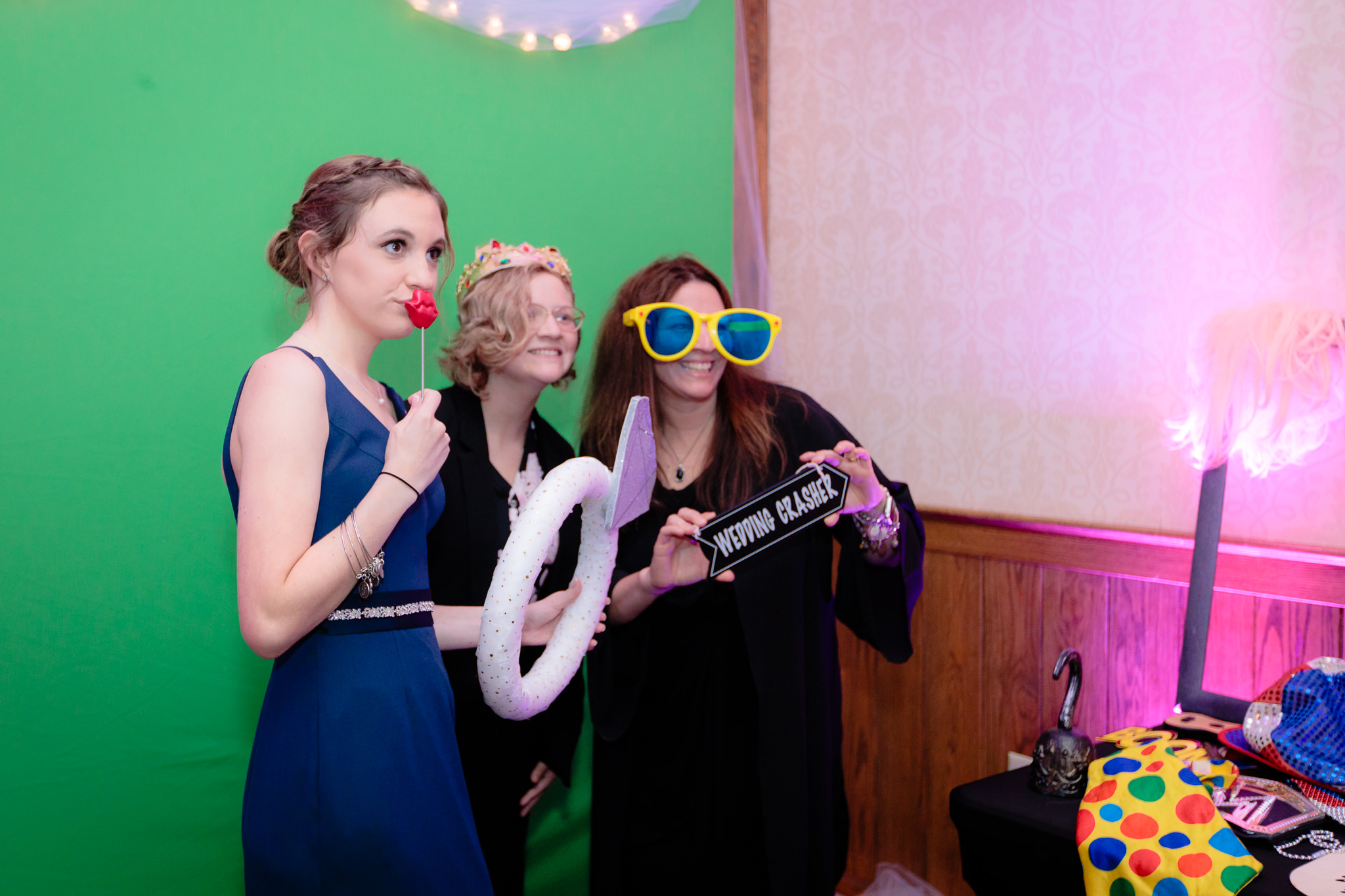 Guests enjoy the photo booth by Selfie Snaps at an Oglebay wedding