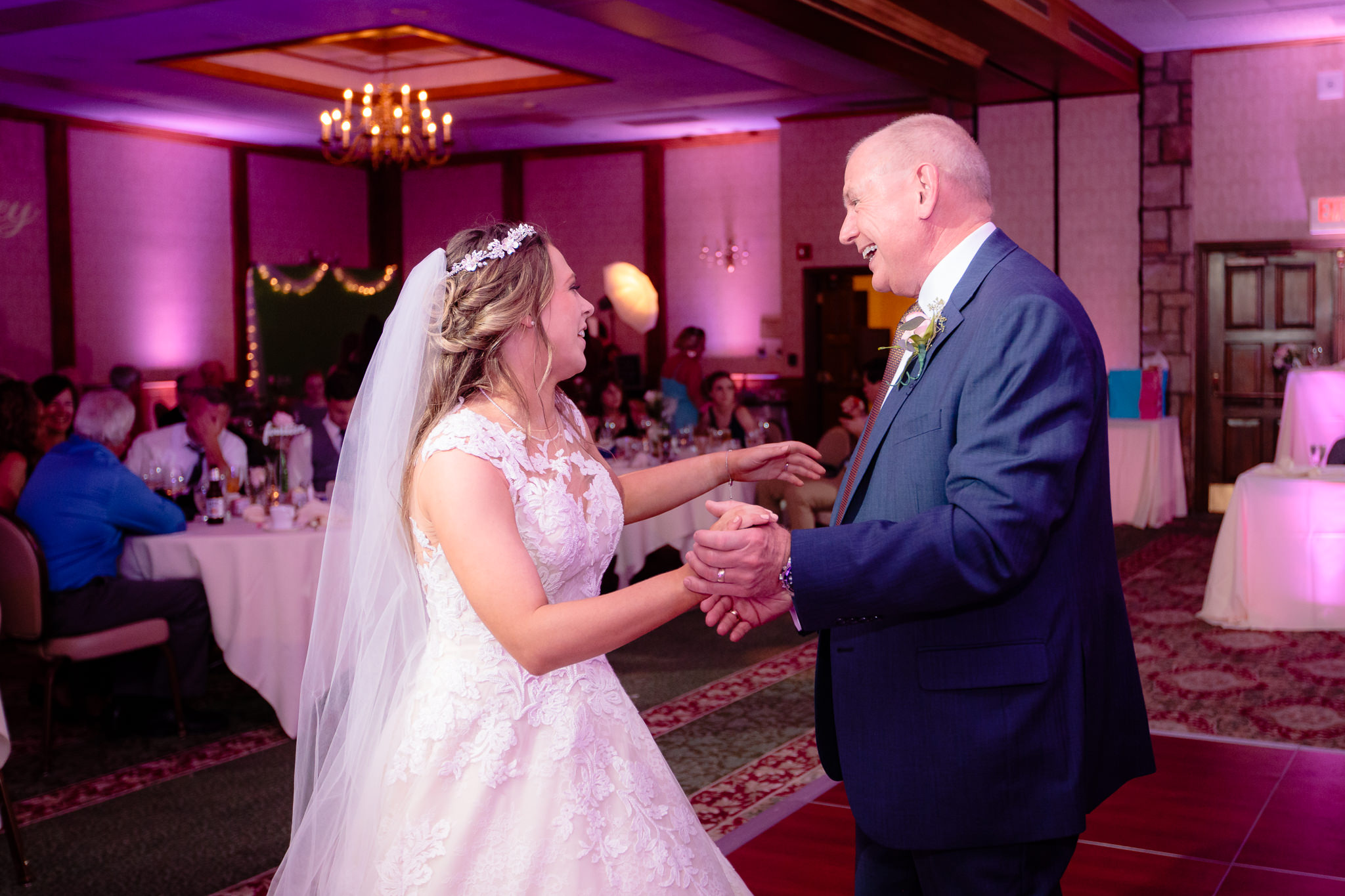 Bride dances with her father-in-law at an Oglebay wedding