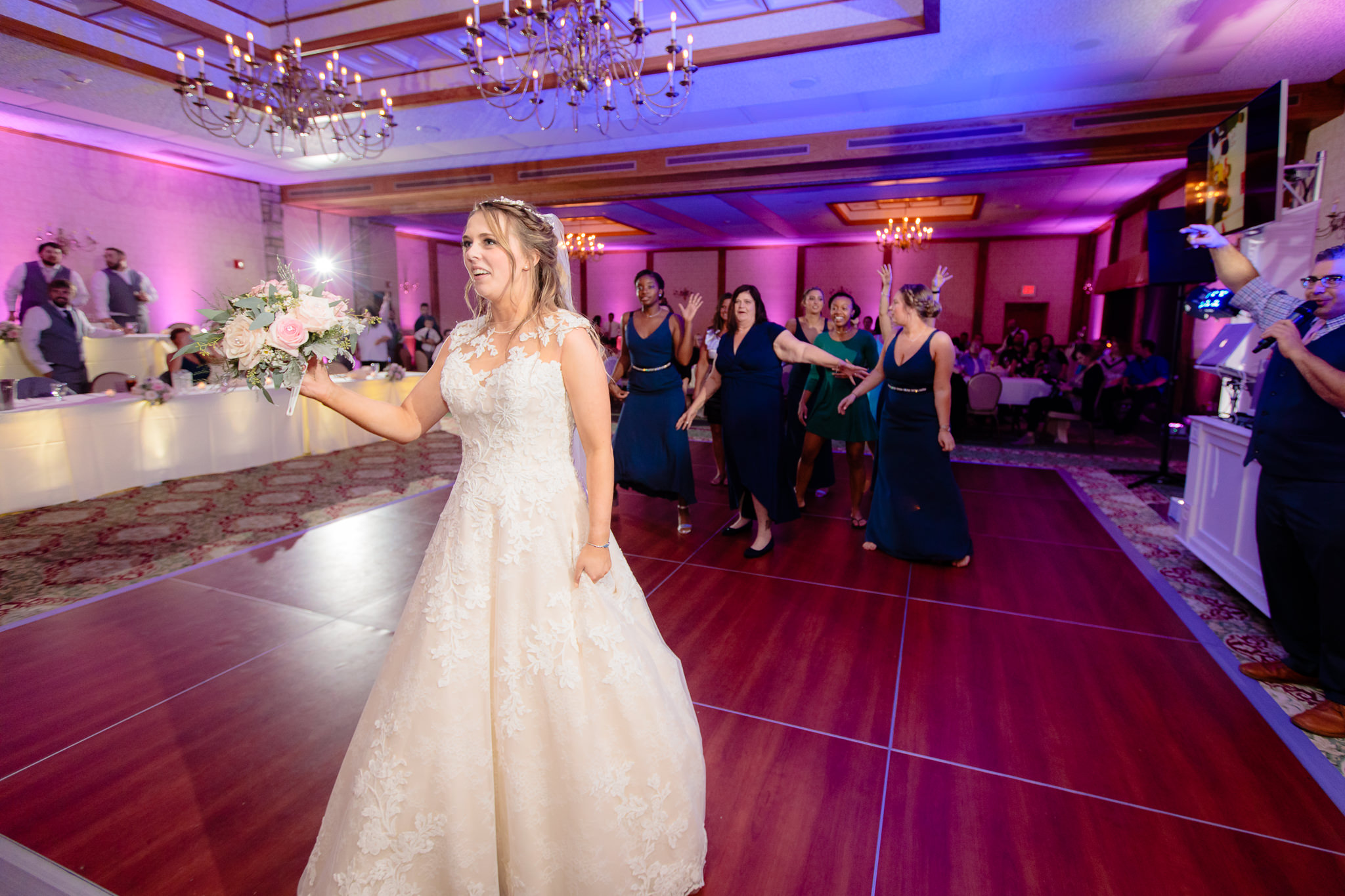 Bride gets ready to toss her bouquet at an Oglebay wedding