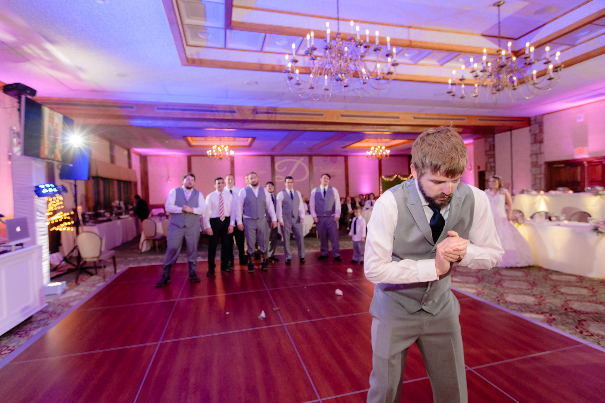 Groom prepares to toss the garter at an Oglebay wedding