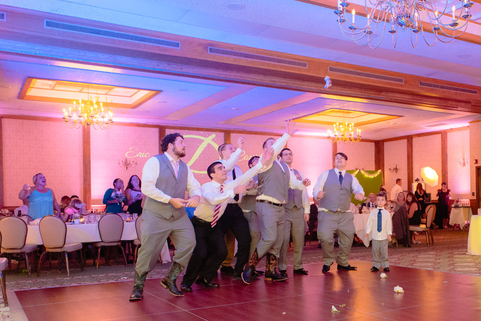 Single guys jump for the garter at an Oglebay wedding