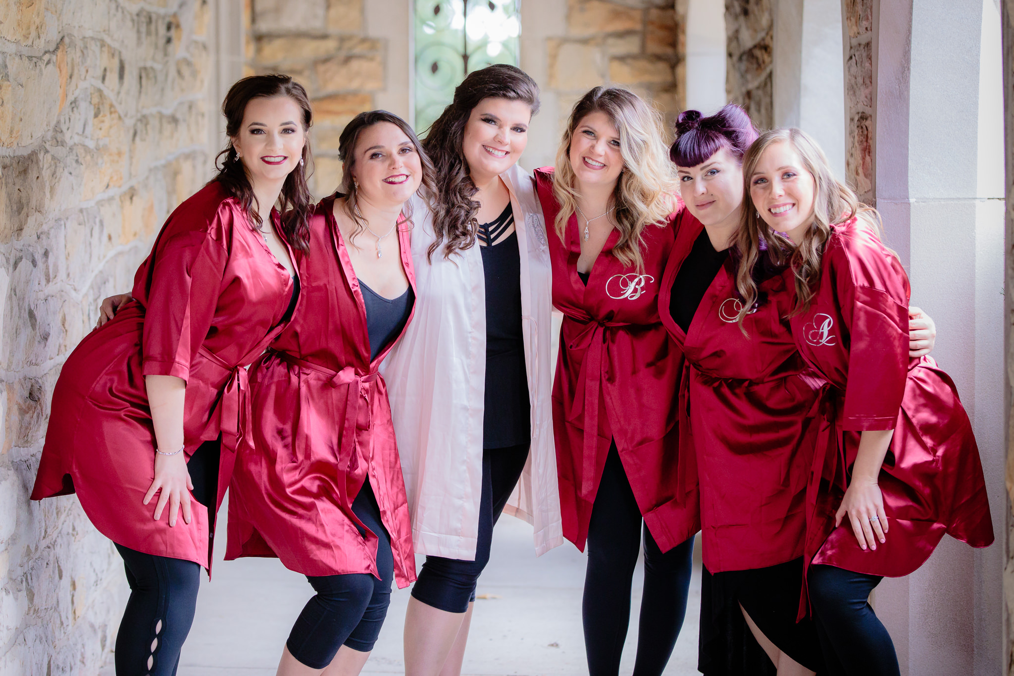 Bridesmaids and bride and in matching maroon and pink robes before the wedding ceremony at Mt. Lebanon United Methodist Church