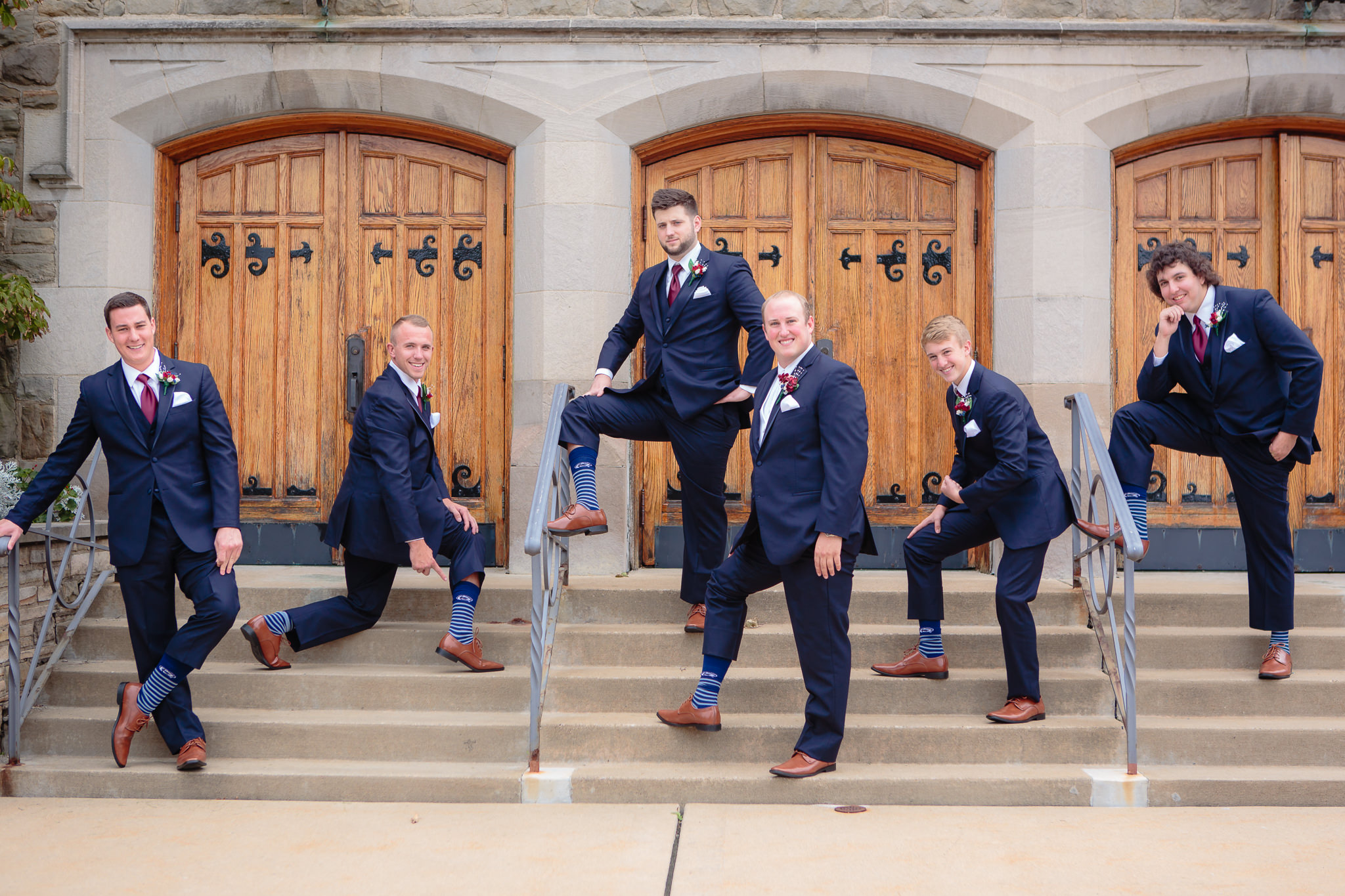 The groom and groomsmen showing off their fun striped socks outside of Mt. Lebanon United Methodist Church