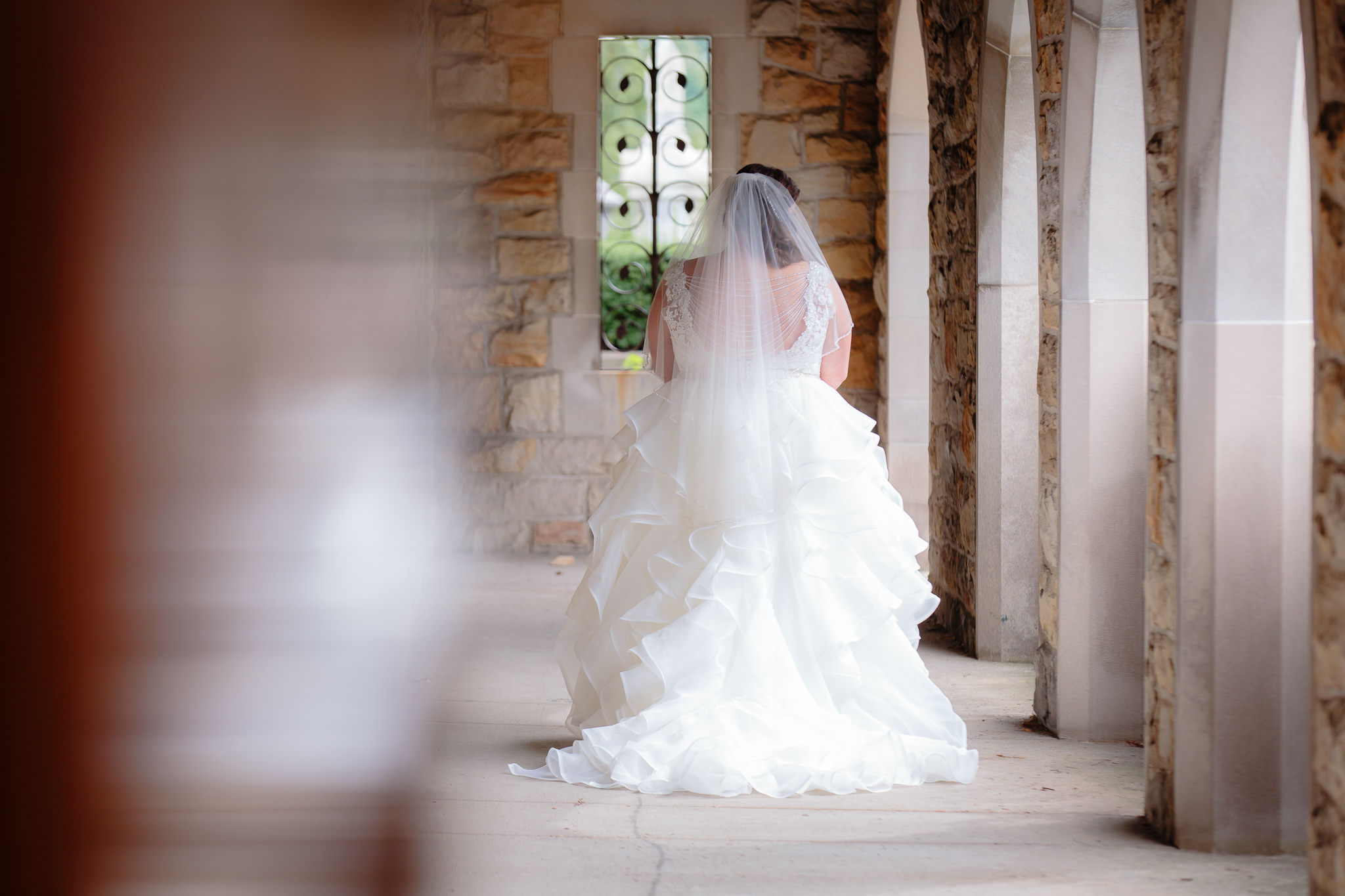 The back of the bride's dress, showing off the ruffled train at Mt. Lebanon United Methodist Church