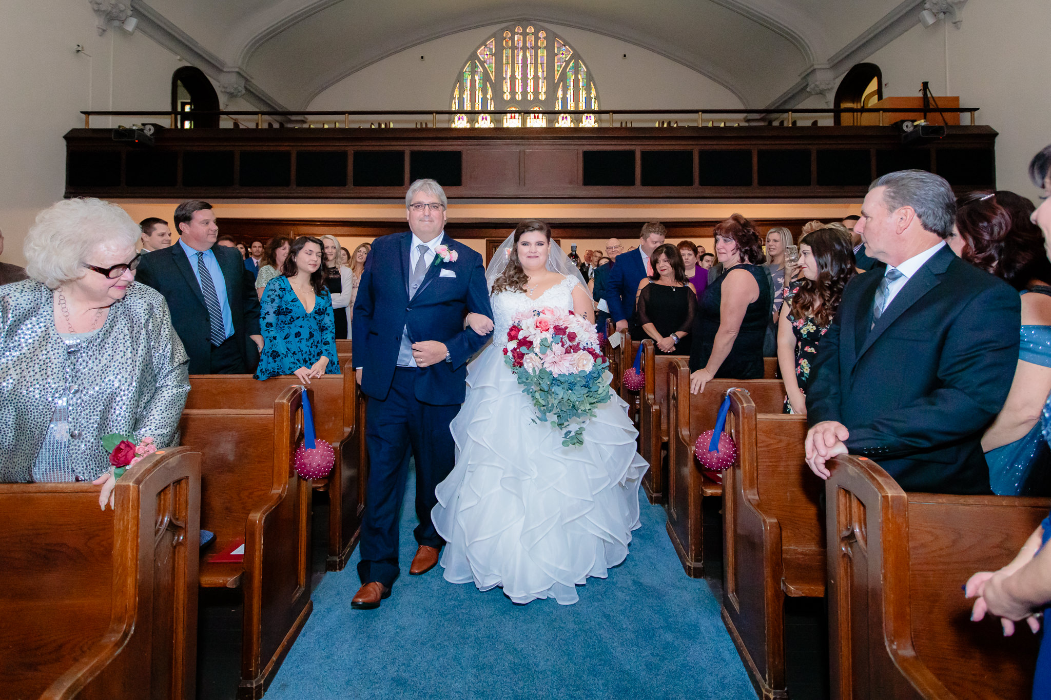 The bride and her father walking down the aisle at Mt. Lebanon United Methodist Church