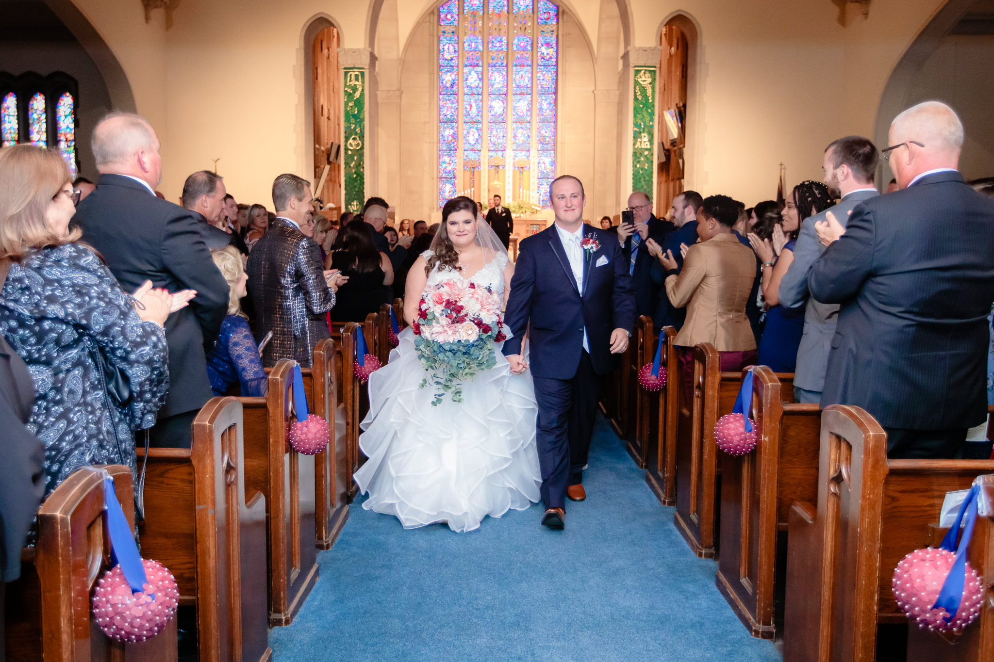 The couple walks down the aisle after being pronounced husband and wife at Mt. Lebanon United Methodist Church