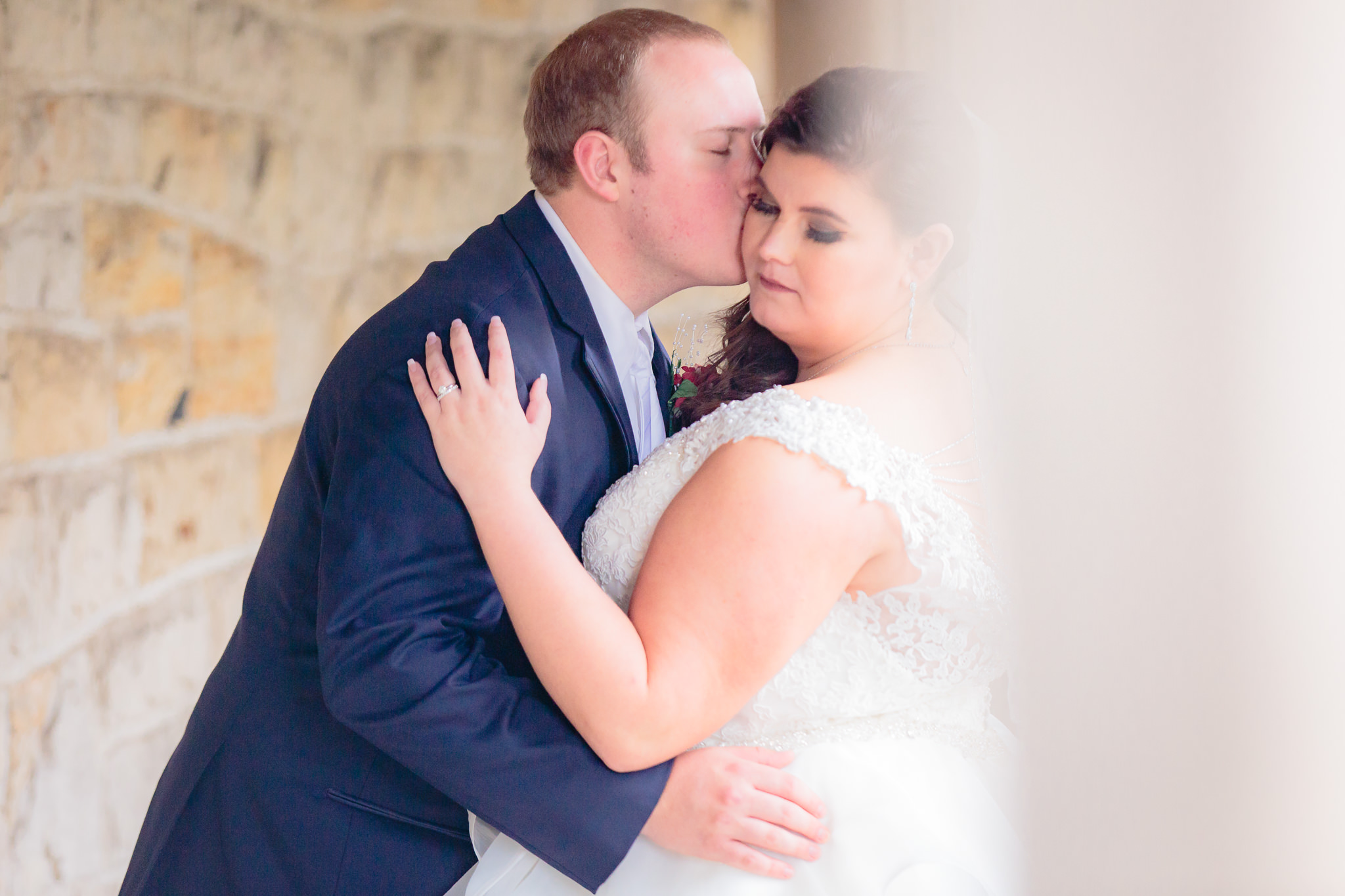 A kiss on the cheek for the bride from groom at Mt. Lebanon United Methodist Church