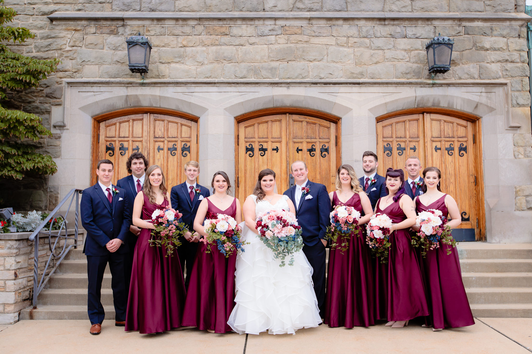 The entire wedding party poses together outside of Mt. Lebanon United Methodist Church