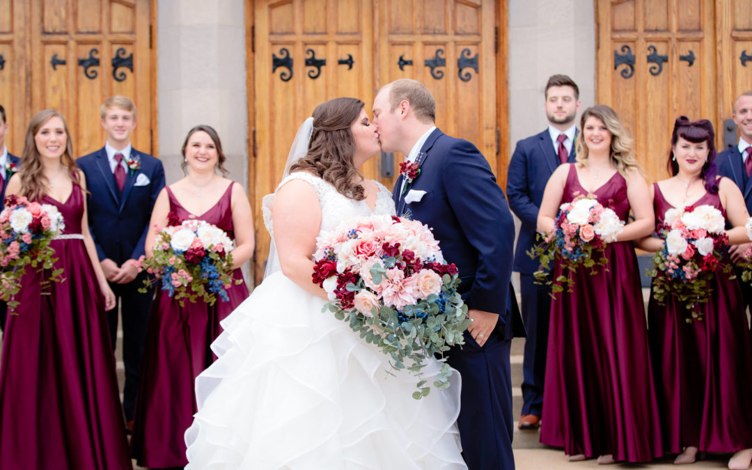 Bride and groom share a kiss infront of the wedding party at Mt. Lebanon United Methodist Church