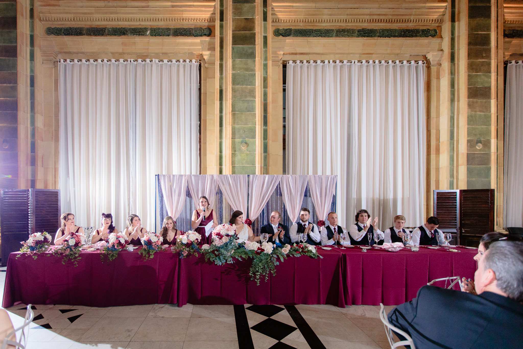 The wedding party sits at the head table at the Pennsylvanian reception